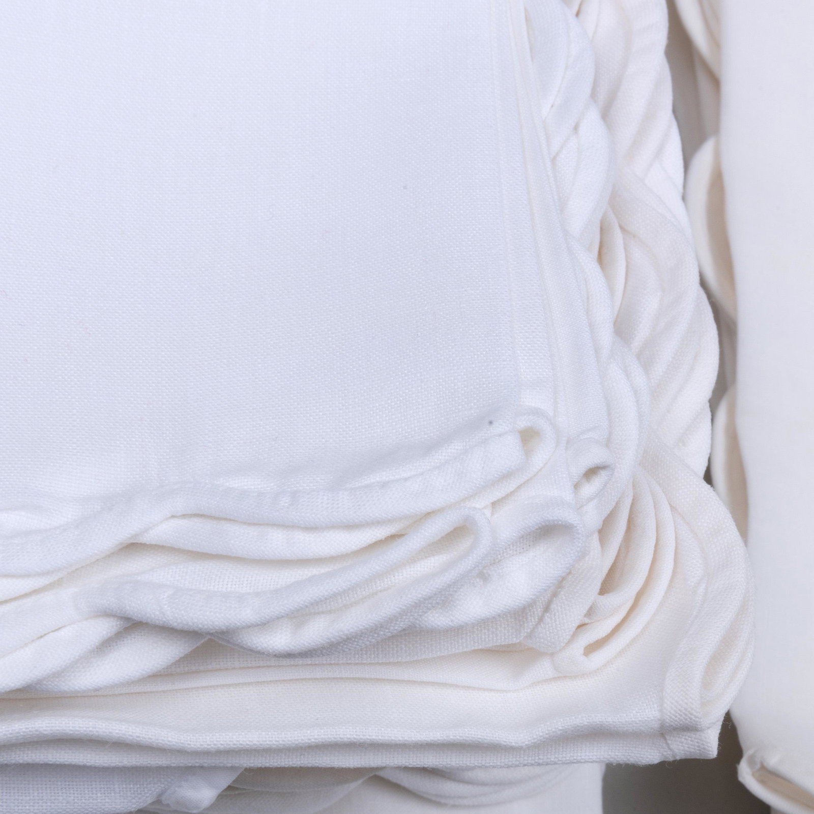 Group of Napkins with Scalloped Edges: Group of Napkins with Scalloped Edges Comprising: A set of nine white large dinner napkins, 20 x 20 in. A group of forty similar white dinner napkins, 15 x 15 in. A set of twenty cream dinner napkins,