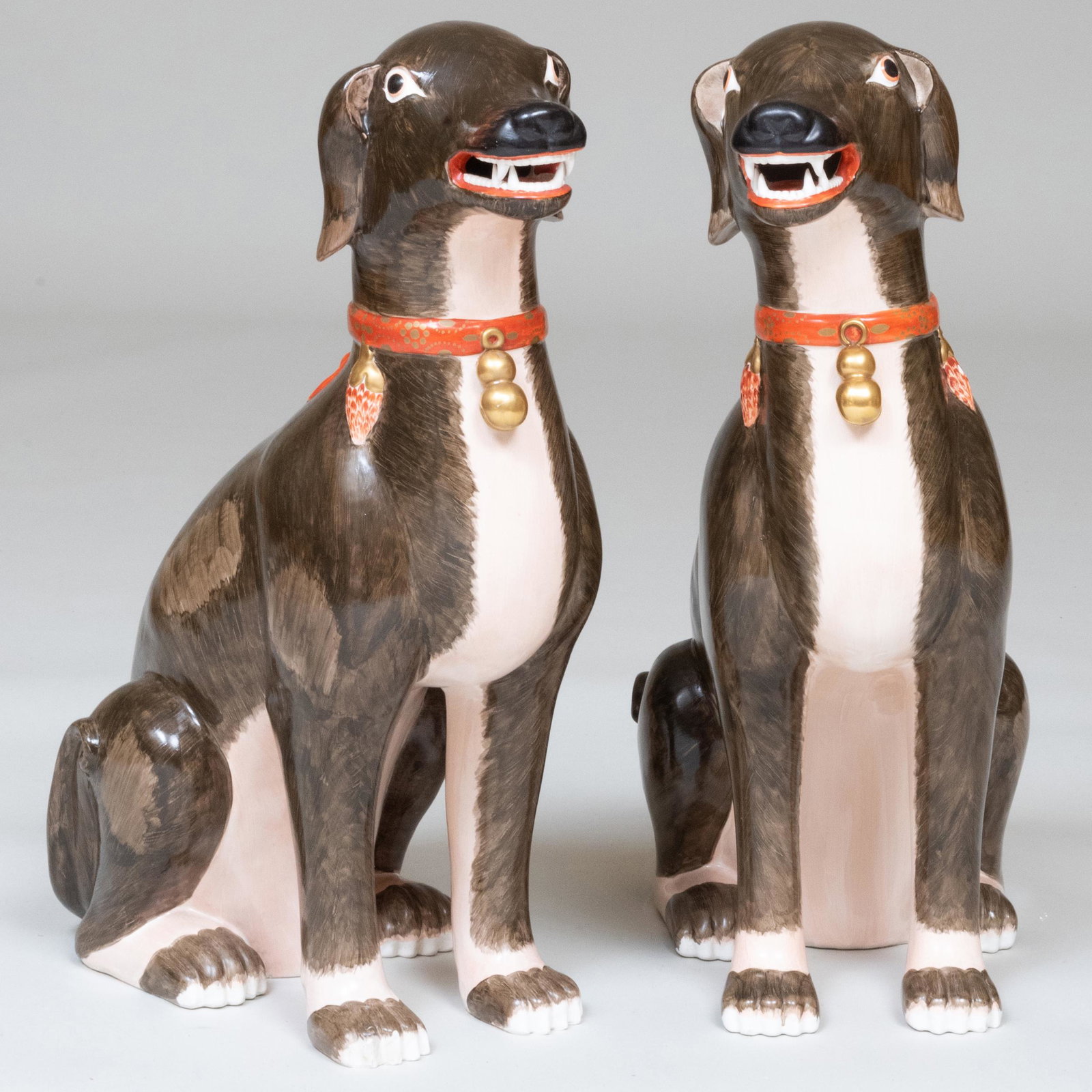 Large Pair of Italian Chinese Export Style Porcelain: Large Pair of Italian Chinese Export Style Porcelain Models of Seated Dogs Impressed mark. 23 1/2 x 8 x 14 in. Gracious Living: The Collection From a Home Designed by Kevin McNamara, East Hampton, NY