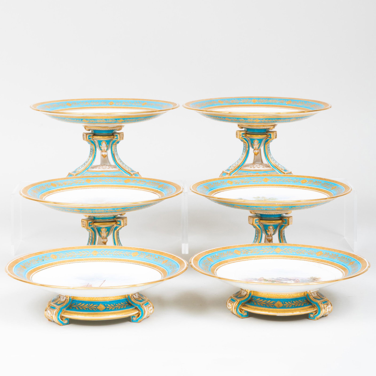 Set of Six Mintons Turquoise Ground Porcelain Compotes: Set of Six Mintons Turquoise Ground Porcelain Compotes Impressed marks. Comprising: Four tall compotes decorated with landscapes and seascapes A pair of low compotes decorated with a church ruin and a