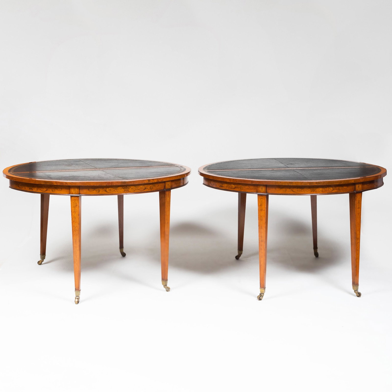 Pair of George III Style Inlaid Satinwood Folding Games: Pair of George III Style Inlaid Satinwood Folding Games Tables Each opening to a leather-lined gaming surface. 29 1/4 x 48 x 23 3/4 in. (closed), 28 1/4 x 48 x 47 1/2 in. (open).