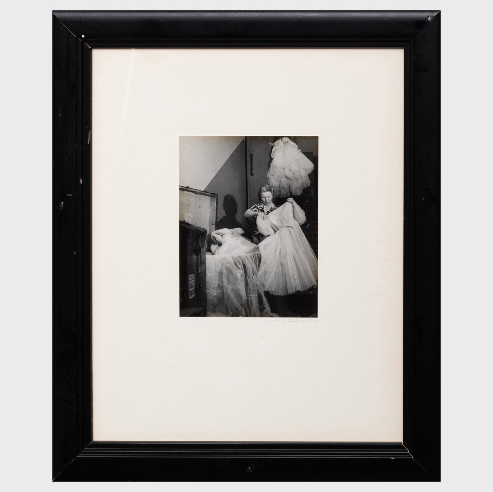 Larry Colwell (1911-1971): Untitled (Woman with Ballet: Larry Colwell (1911-1971): Untitled (Woman with Ballet Costumes) Gelatin silver print, signed on the mount. 6 3/8 x 4 3/8 in. (sheet), 16 1/4 x 13 1/4 in. (frame).