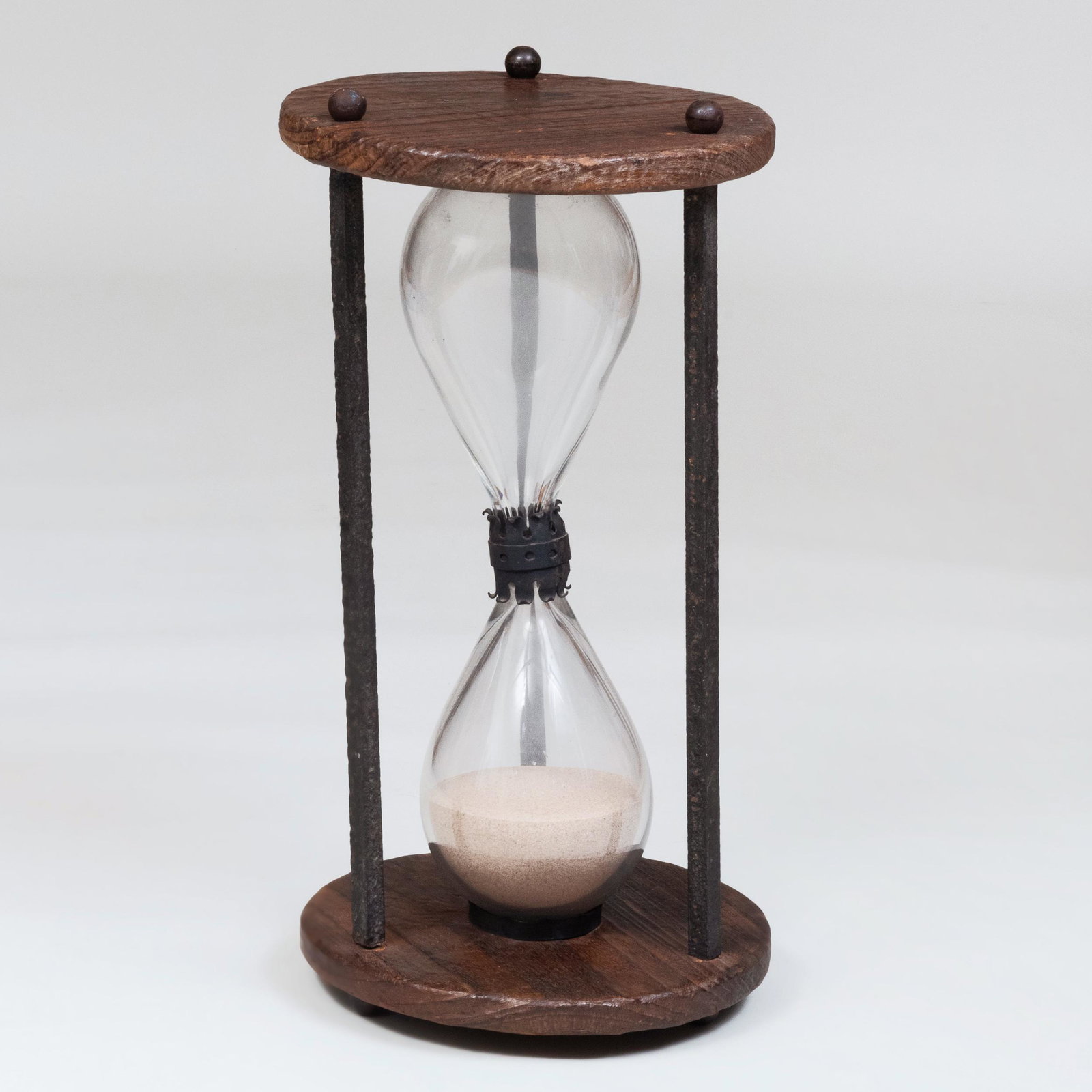 Large Wrought Iron-Mounted Wood Hourglass: Large Wrought Iron-Mounted Wood Hourglass 30 x 15 in. diam. Masterful Mix : A Residence Designed by Stephen Sills for Barbara Cirkva and John Schumacher