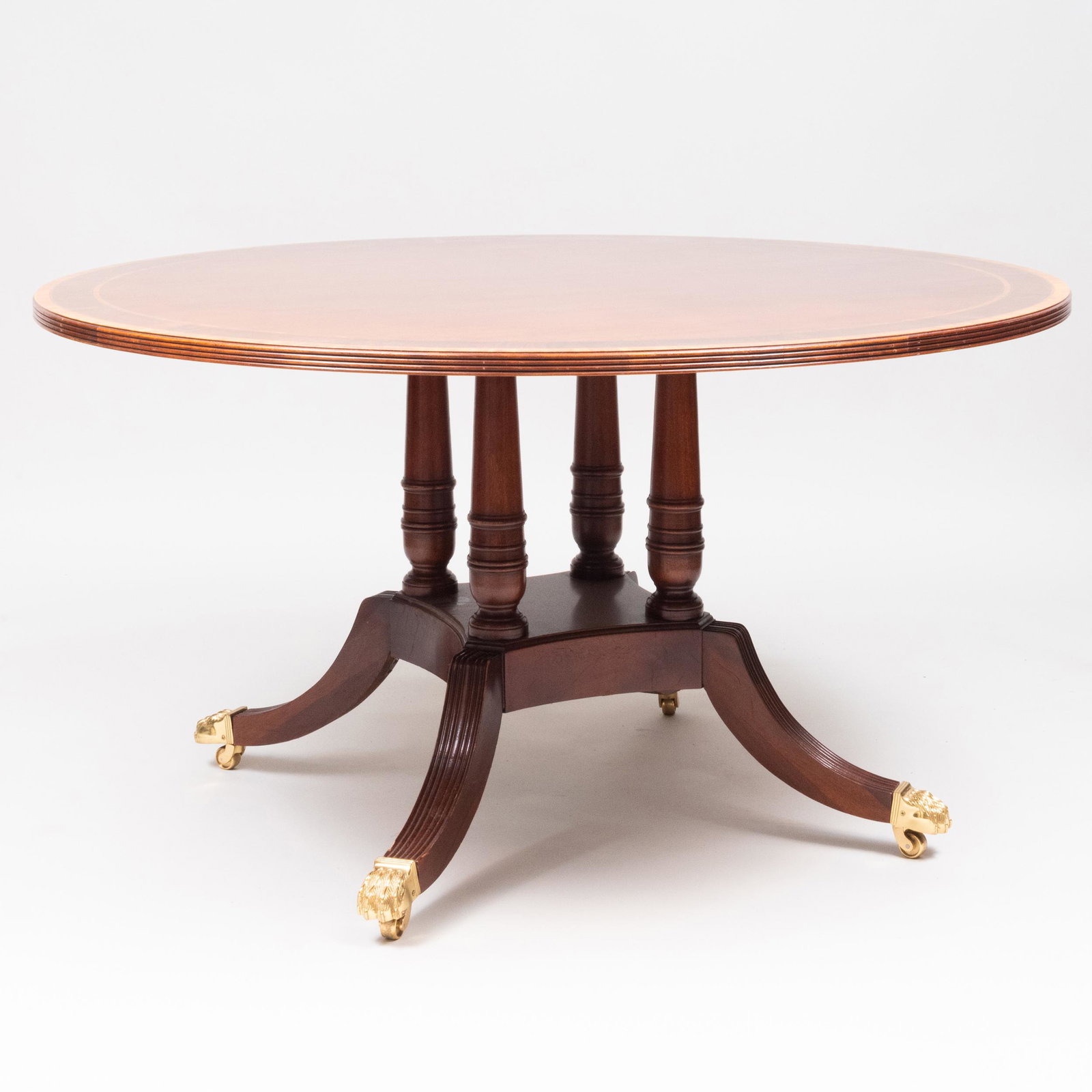 Regency Style Inlaid Mahogany Center Table, of Recent: Regency Style Inlaid Mahogany Center Table, of Recent Manufacture Raised on paw feet with casters, with a 'Councill' label underneath the top. 30 1/2 x 4 ft. 6 in.