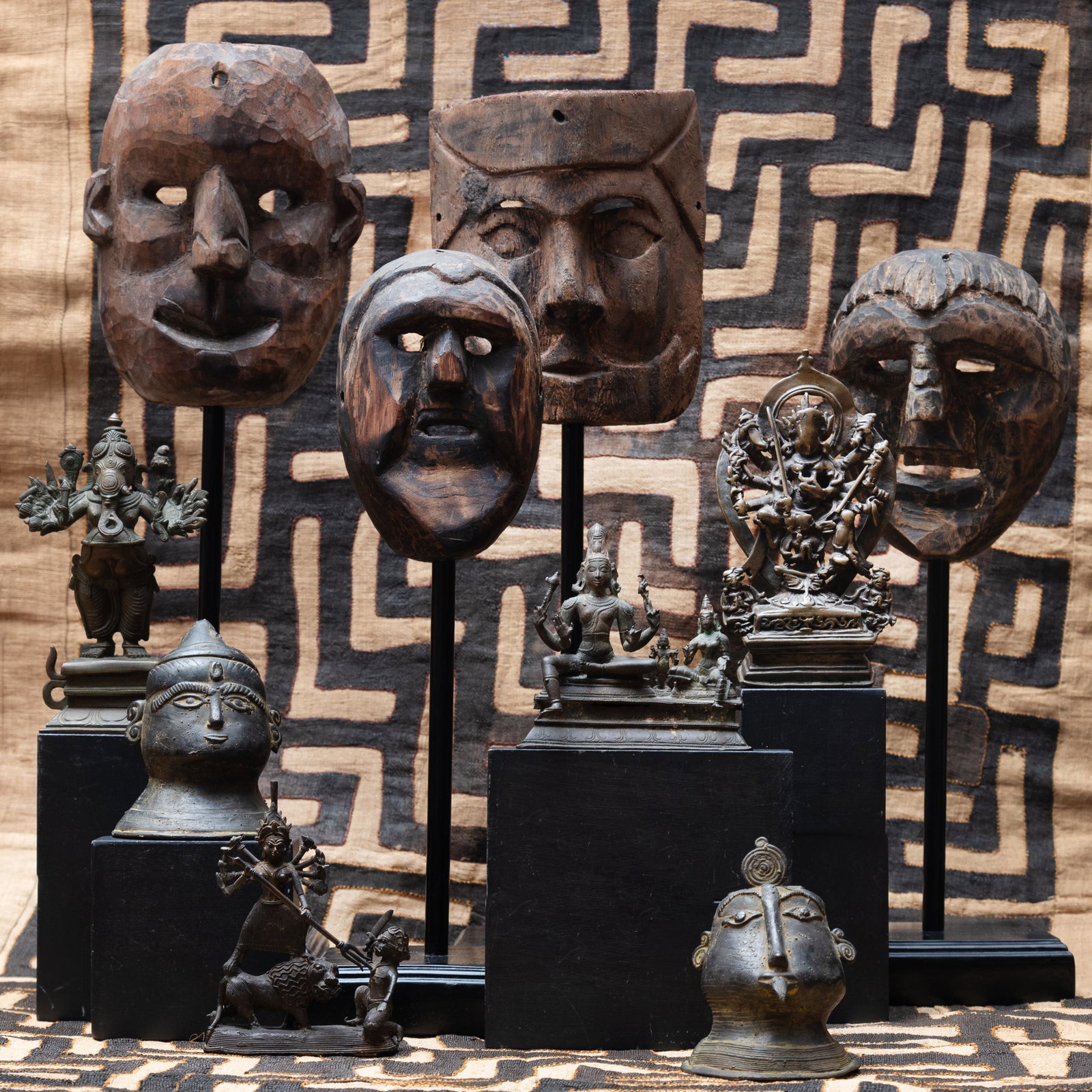 Group of Four Ethnographic Carved Wood Masks, Possibly: Group of Four Ethnographic Carved Wood Masks, Possibly Tibetan Raised on stands. The largest 21 in. high (overall). The Red Piano Too, South Carolina.