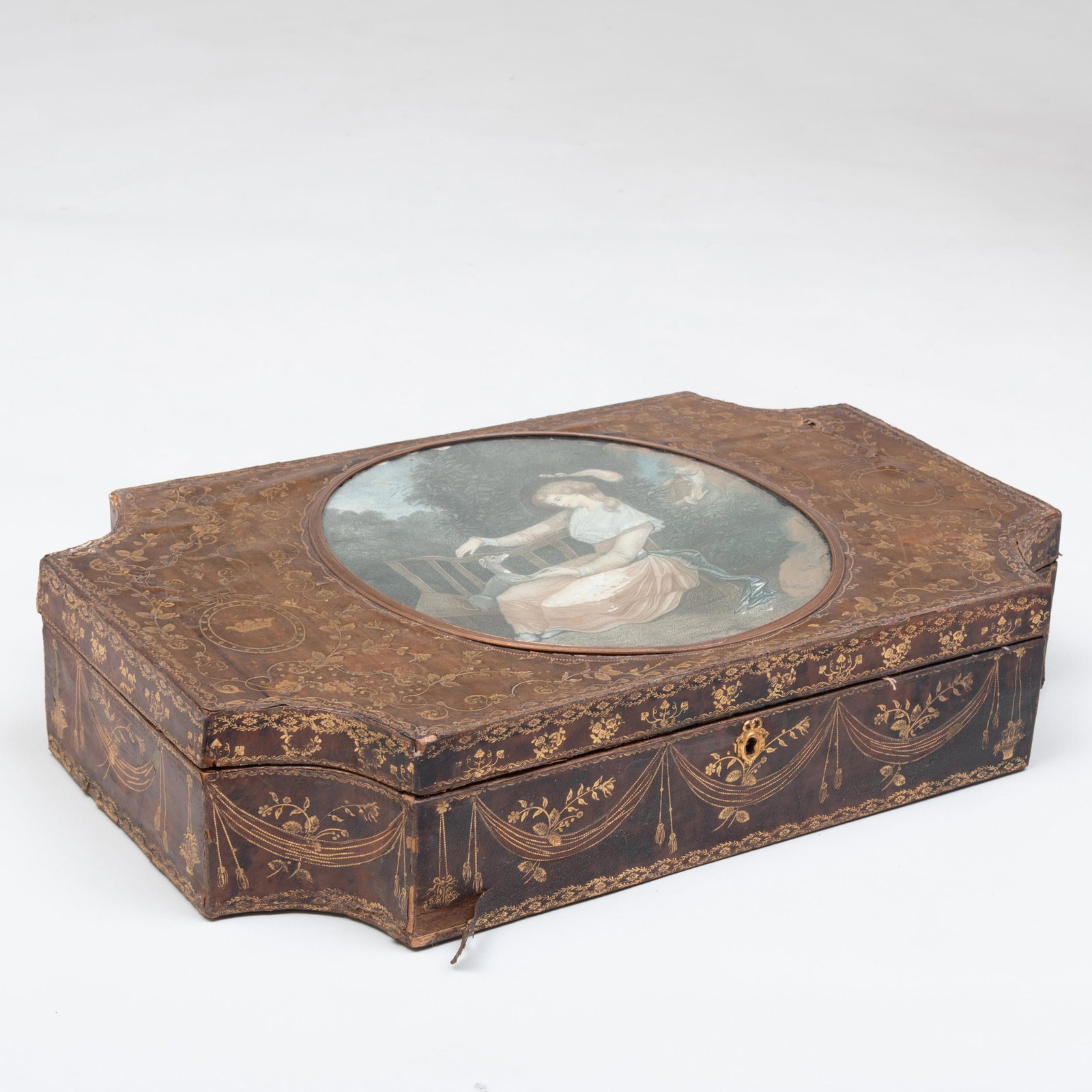 English Gilt-Tooled Leather Box with a Figural Colored: English Gilt-Tooled Leather Box with a Figural Colored Engraving Opening to a damask lined interior, with a label from 'E. Dreyfous 104 E Mount Street, London, W'. 4 1/4 x 20 x 13 in.