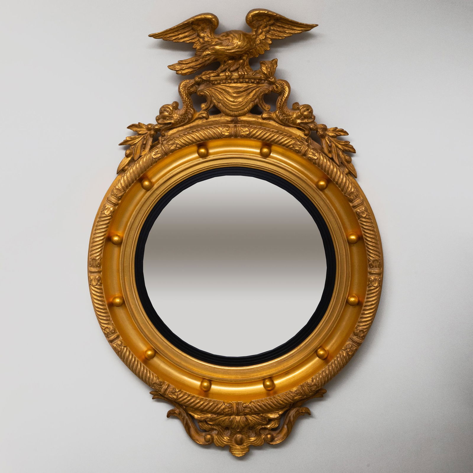 Regency Style Giltwood and Gilt Composition Convex: Regency Style Giltwood and Gilt Composition Convex Mirror, of Recent Manufacture 38 1/2 x 26 in.