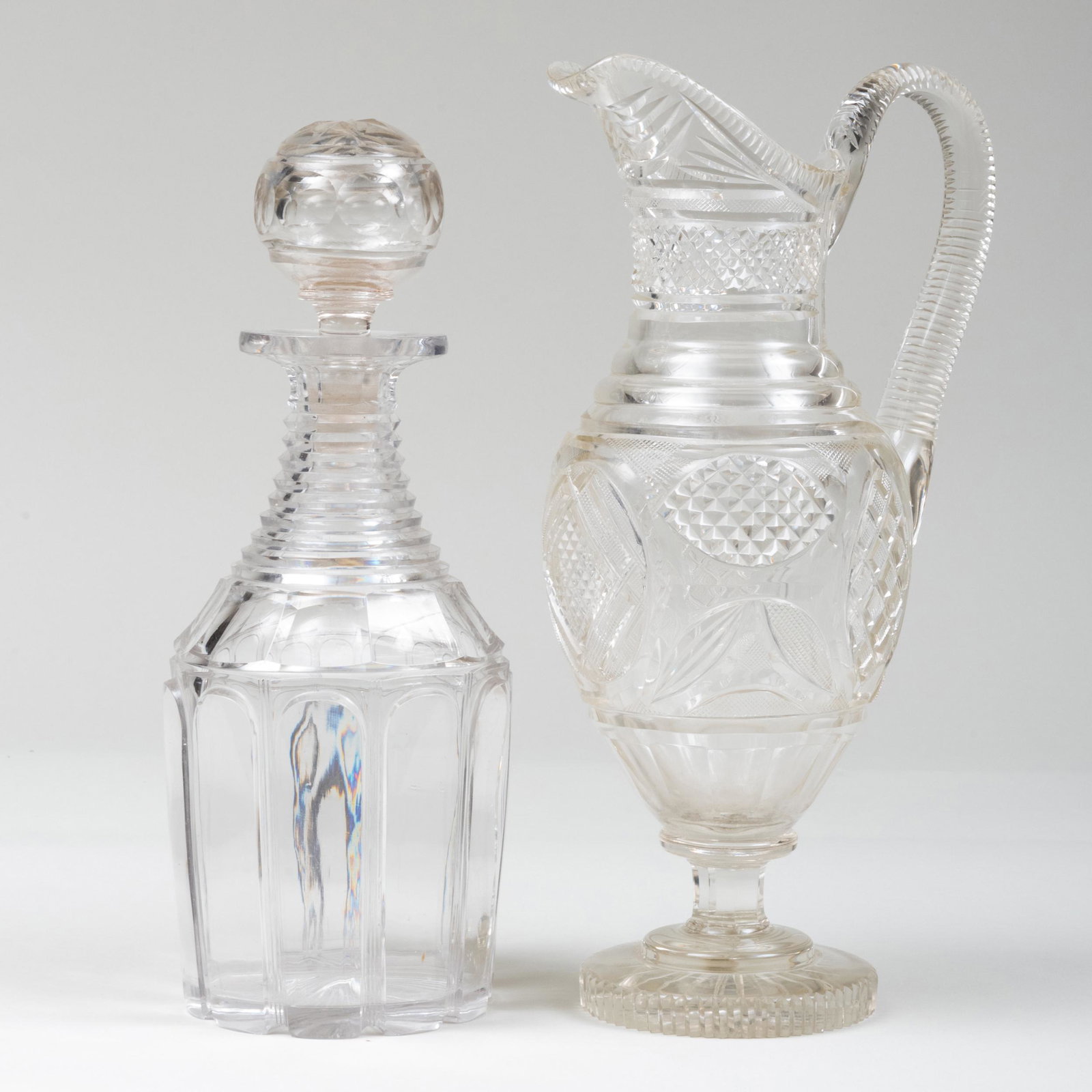 Cut Glass Decanter and Stopper and a Cut Glass Ewer: Cut Glass Decanter and Stopper and a Cut Glass Ewer The decanter 12 x 4 1/2 in. diam., the ewer 12 1/2 x 4 1/2 x 6 3/4 in. Property from the late Zane Studenroth