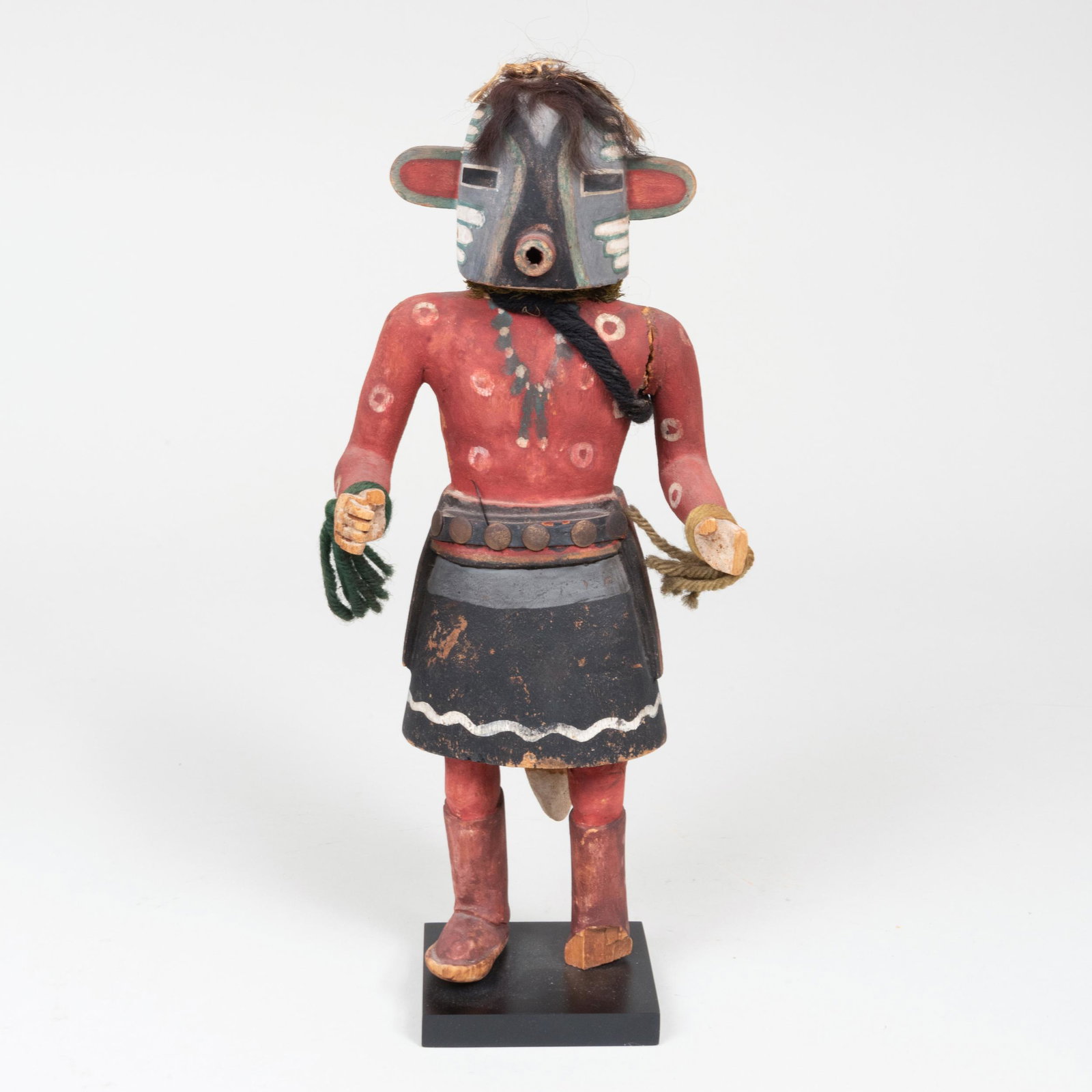 Hopi Painted Wood Kachina Figure: Hopi Painted Wood Kachina Figure Raised on an ebonized stand. 13 3/4 in. high (overall). Property from the Estate of Martin and Faith-Dorian Wright