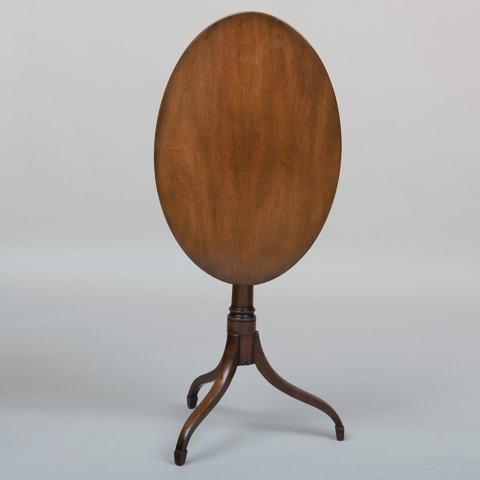 Federal Style Mahogany Oval Tilt-Top Table, Kittinger: Federal Style Mahogany Oval Tilt-Top Table, Kittinger With a Kittinger label underneath top, with an indistinct stamp. 28 x 26 x 17 3/4 in. Property of a Landmark House