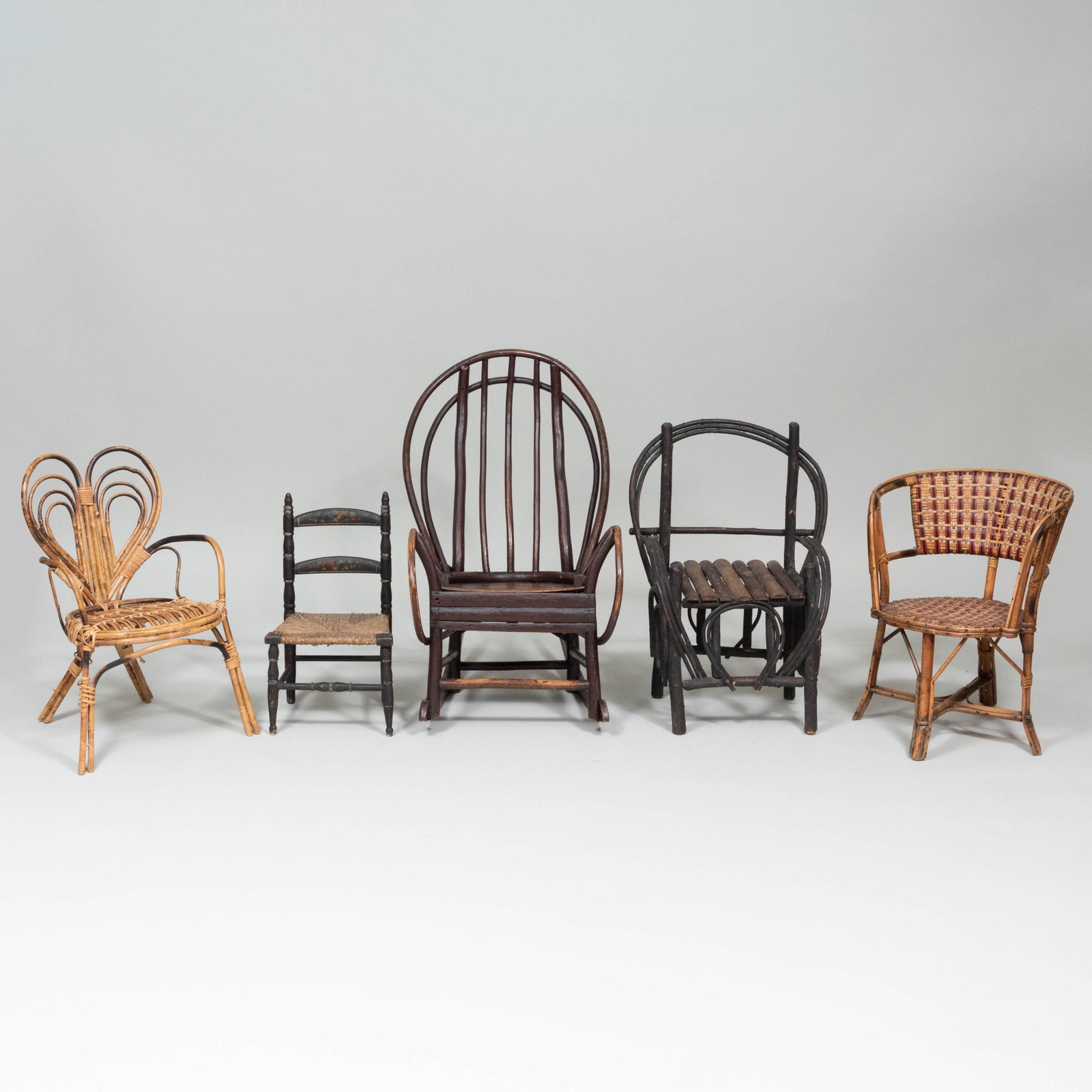 Group of Five Rustic Child's Chairs: Group of Five Rustic Child's Chairs Comprising: Two willow and twig chairs (one a rocking chair) Two bamboo chairs One painted slat back chair with a rush seat The largest 28 3/4 x 17 1/2 x 26