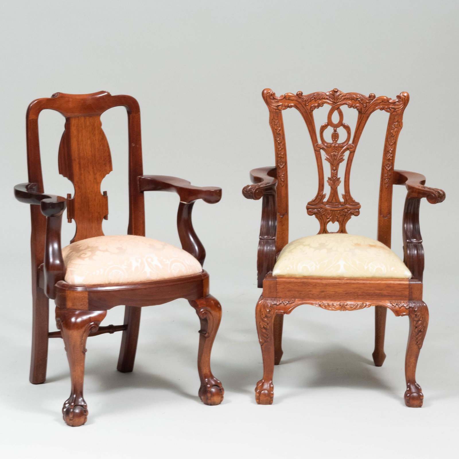 Two English Carved Mahogany Child's Armchairs, of: Two English Carved Mahogany Child's Armchairs, of Recent Manufacture Both fitted with damask upholstered seats. The largest 26 x 17 1/2 x 14 in.