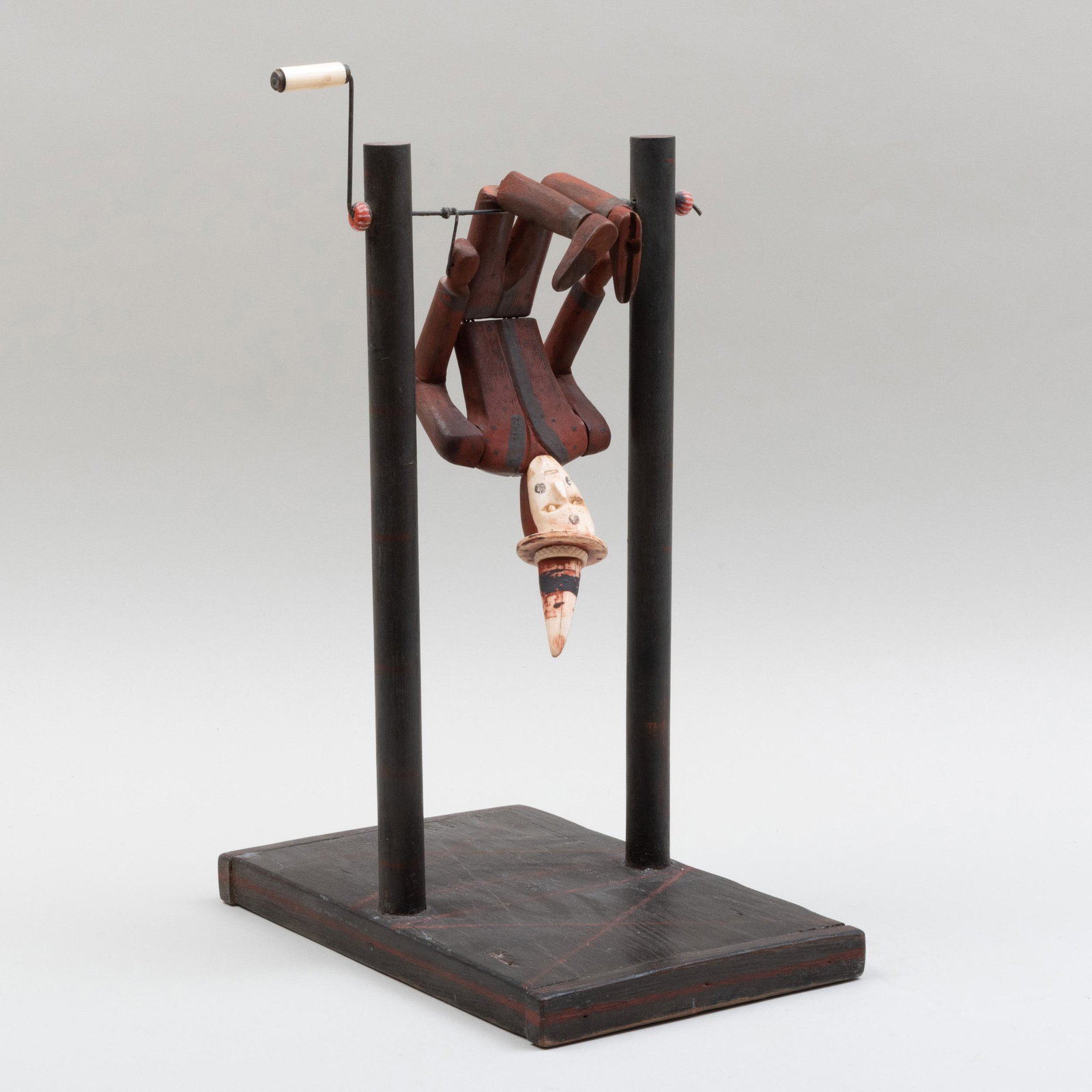 American Folk Art Painted Wood and Bone Figure of an: American Folk Art Painted Wood and Bone Figure of an Acrobat on Stand, New York 19 x 8 1/4 x 12 1/2 in. Ex. Collection of Stephen Clarke, founder of Cooperstown Museum, Cooperstown, NY. This figure wa