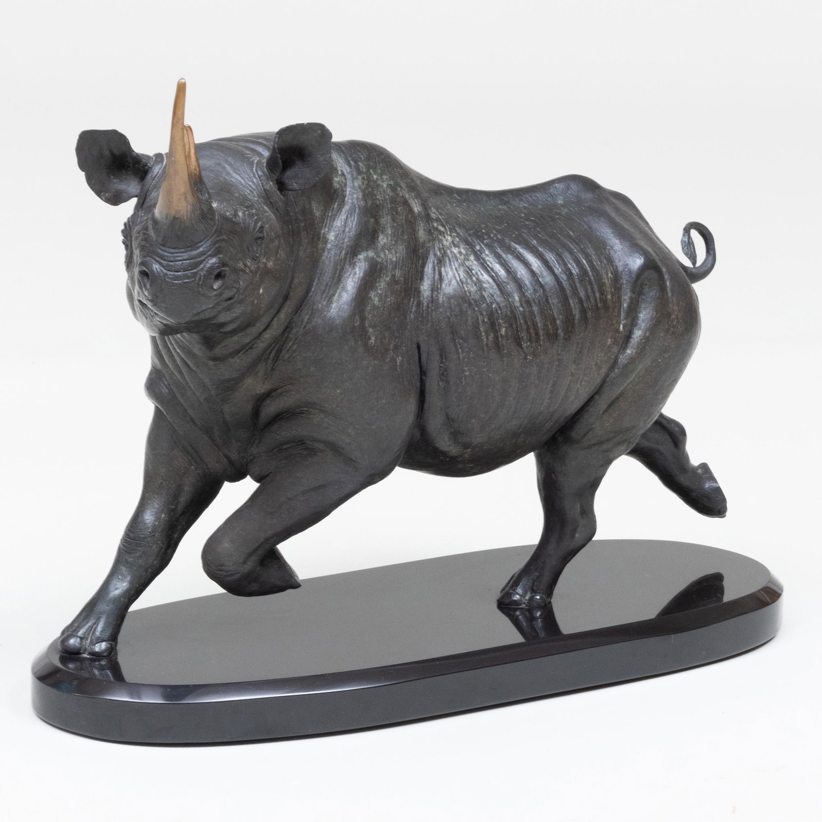 David Schaefer (b. 1955): Rhinoceros: David Schaefer (b. 1955): Rhinoceros Bronze with black patina on a black base, signed with initials 'DS' and numbered 42/200 on the back left leg. 15 1/2 x 23 x 10 in. (with base).