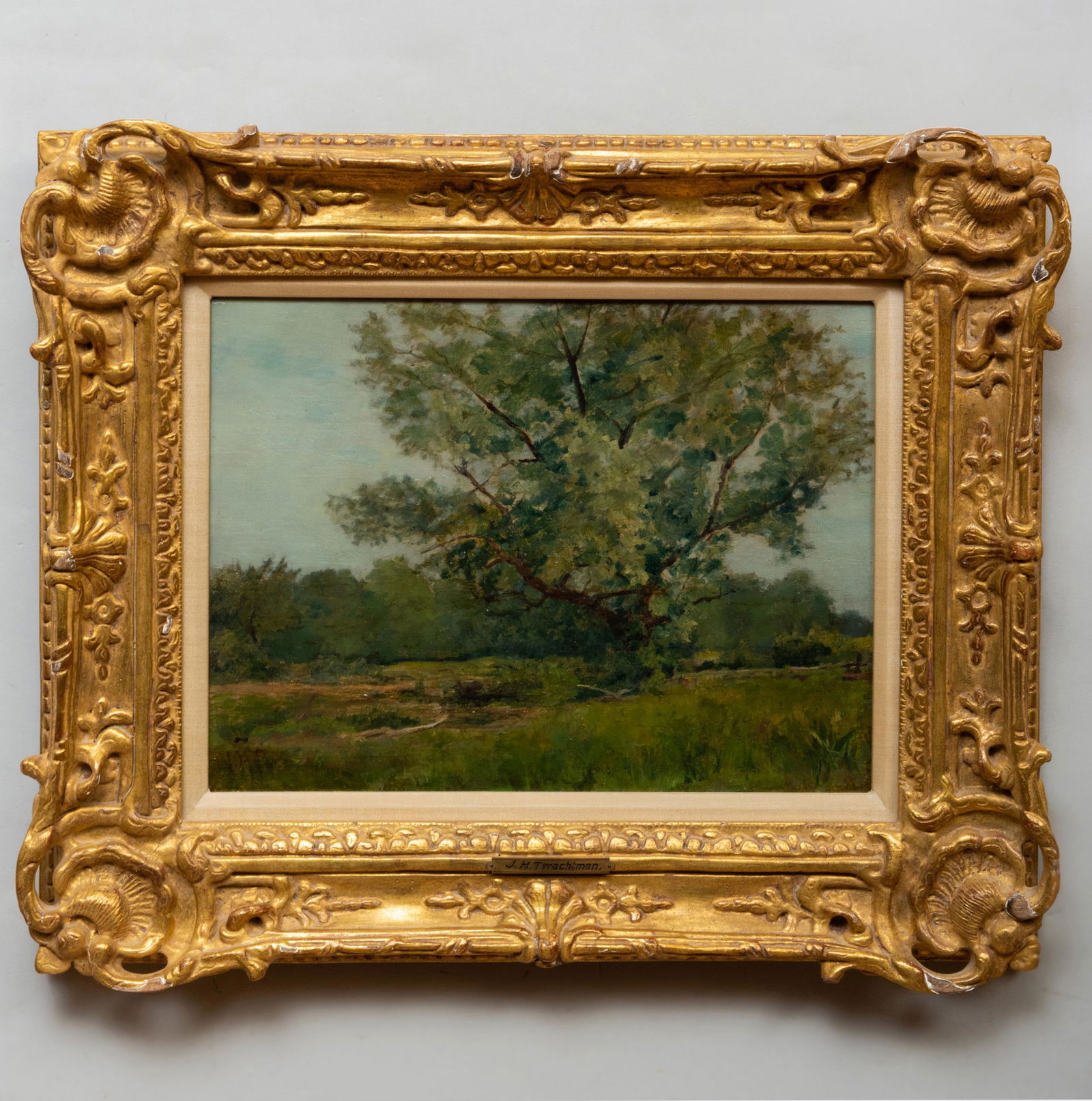 Attributed to John Henry Twachtman (1853-1902): The: Attributed to John Henry Twachtman (1853-1902): The Great Oak Oil on board, c. 1882, signed with initials 'J.H.T.' lower left, with label from Chapellier Galleries, NY. 11 1/4 x 16 in., 19 1/2 x 23 1/