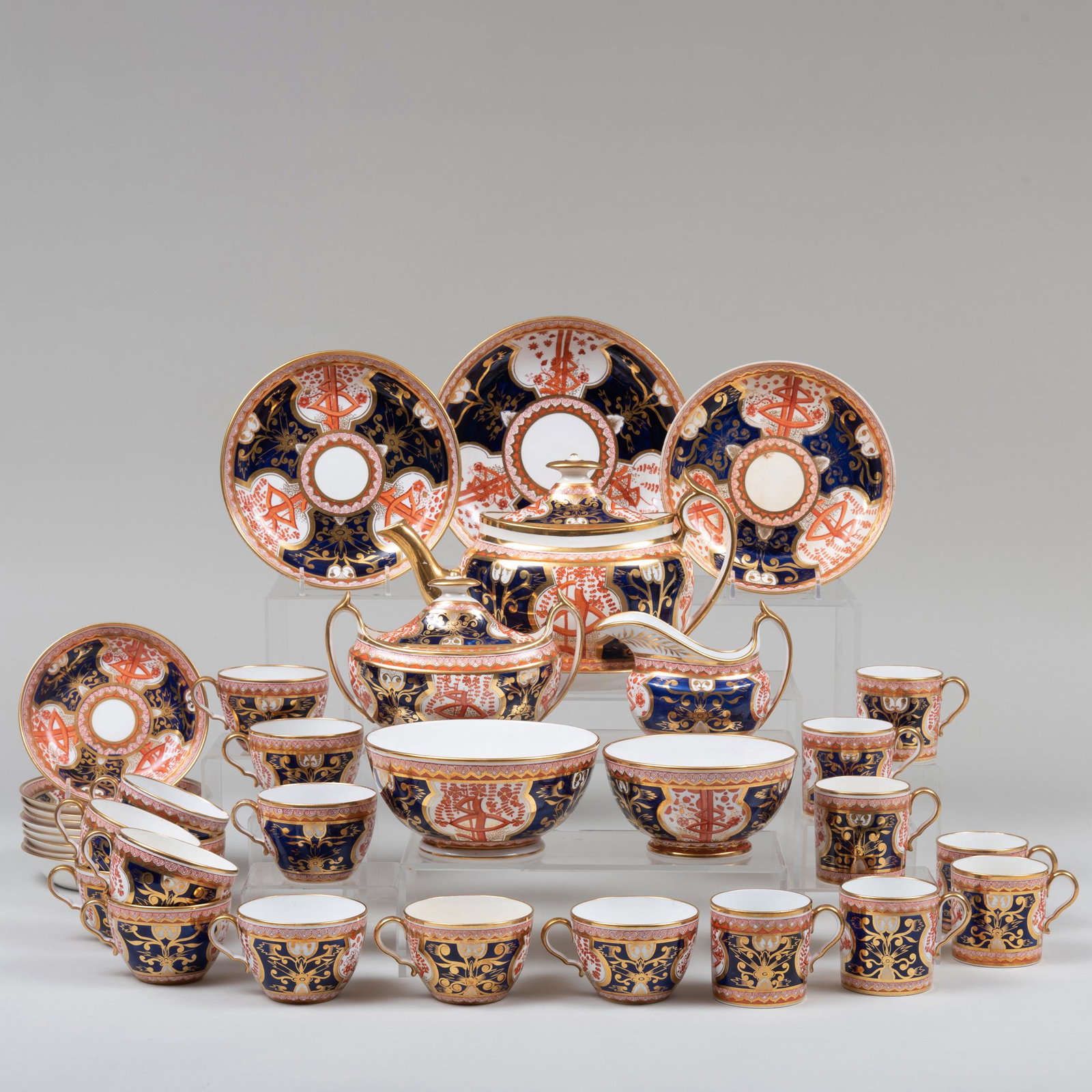 English Imari Porcelain Tea Service in the 'Dollar: English Imari Porcelain Tea Service in the 'Dollar Tree' Pattern, Probably Spode Unmarked. Comprising: A teapot, cover and stand A milk jug A sugar bowl and cover A waste bowl A smaller waste bowl A