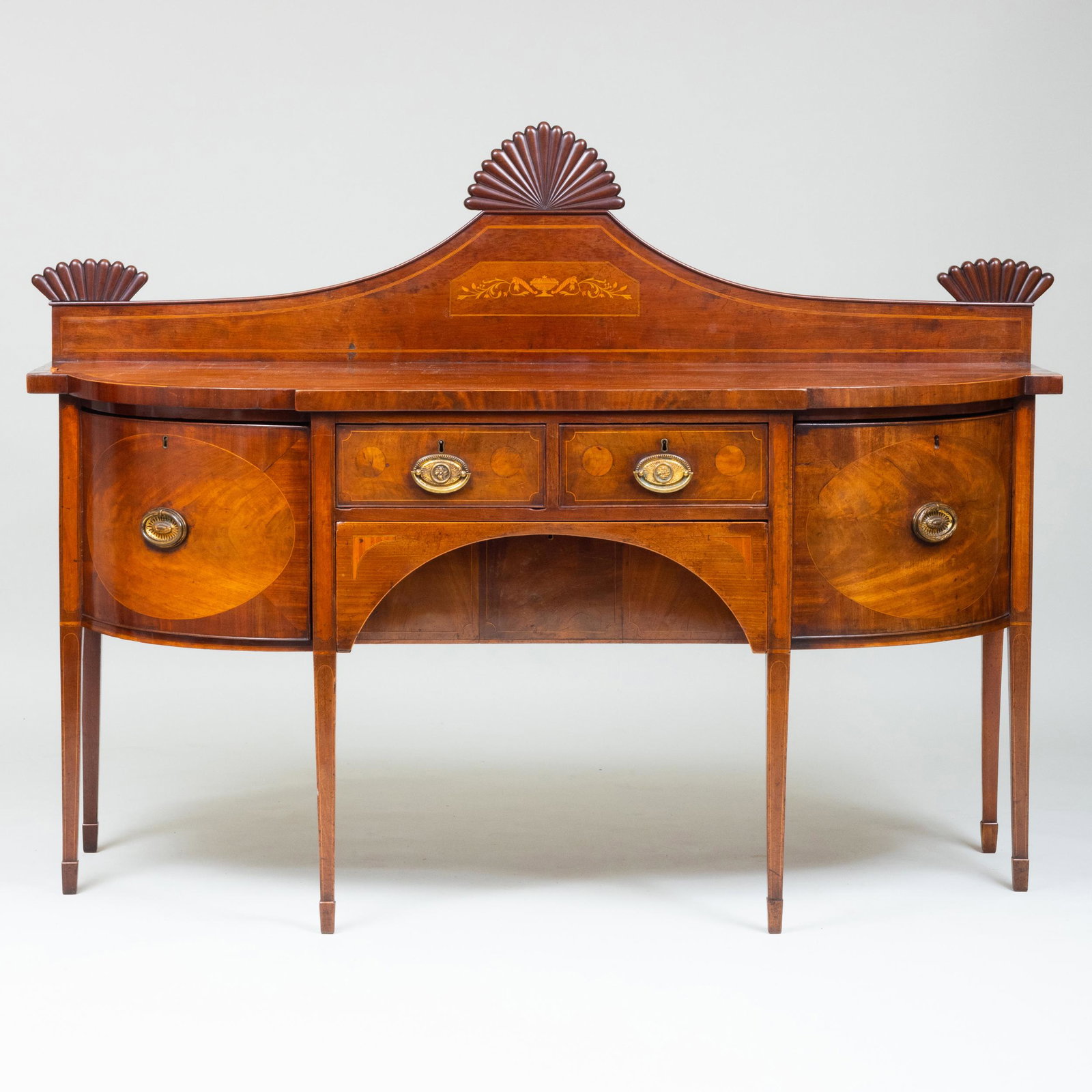 George III Inlaid Mahogany Sideboard: George III Inlaid Mahogany Sideboard Fitted with a later splashboard, above two short and one bottle drawer on the left and a swing door on the right, above a butler's deep drawer, raised on tapering 