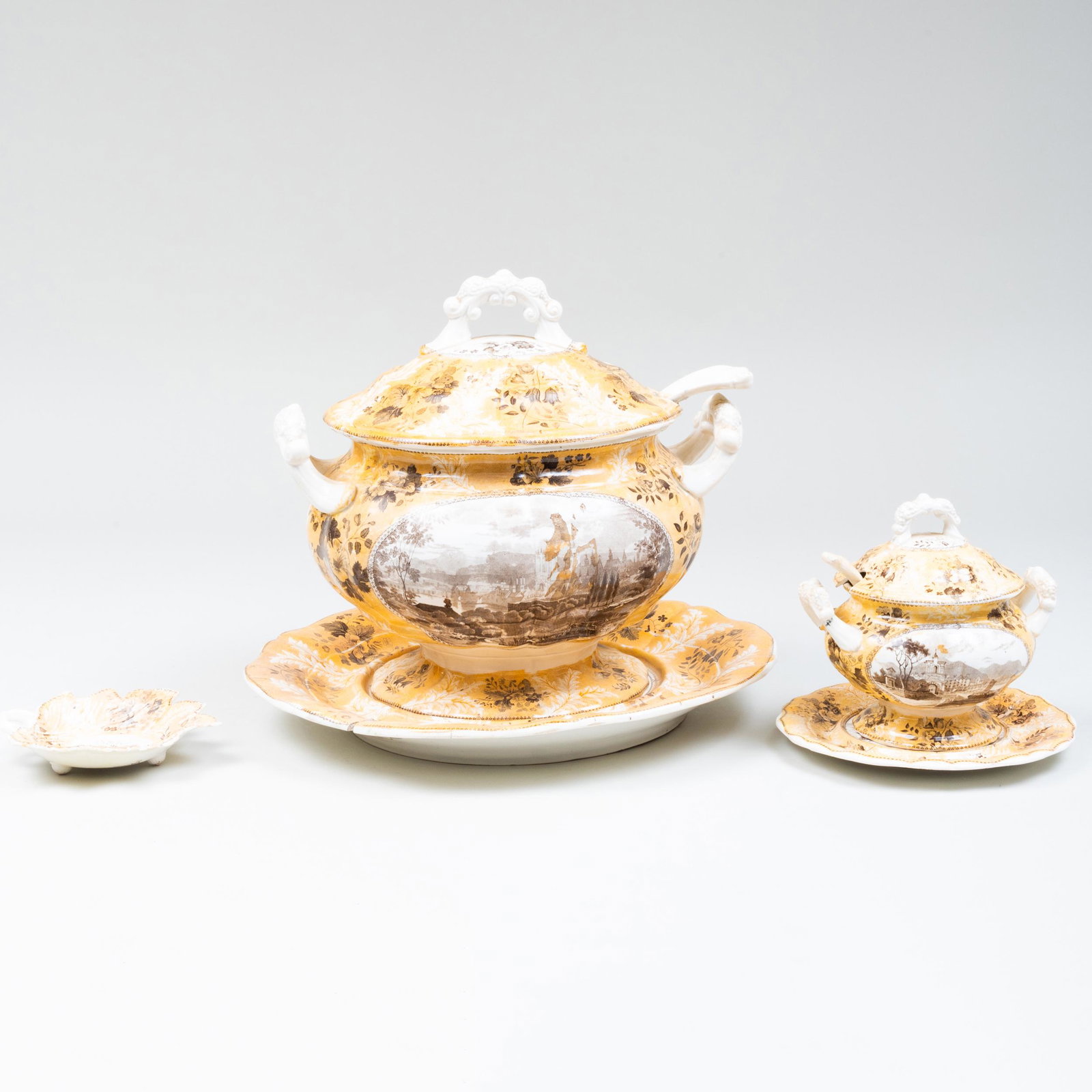 Enoch Wood and Sons Transfer Printed Wares in the: Enoch Wood and Sons Transfer Printed Wares in the 'Mainz' Pattern Black printed mark. Comprising: A soup tureen, cover and stand A soup ladle A sauce tureen cover and stand A sauce ladle A leaf shaped