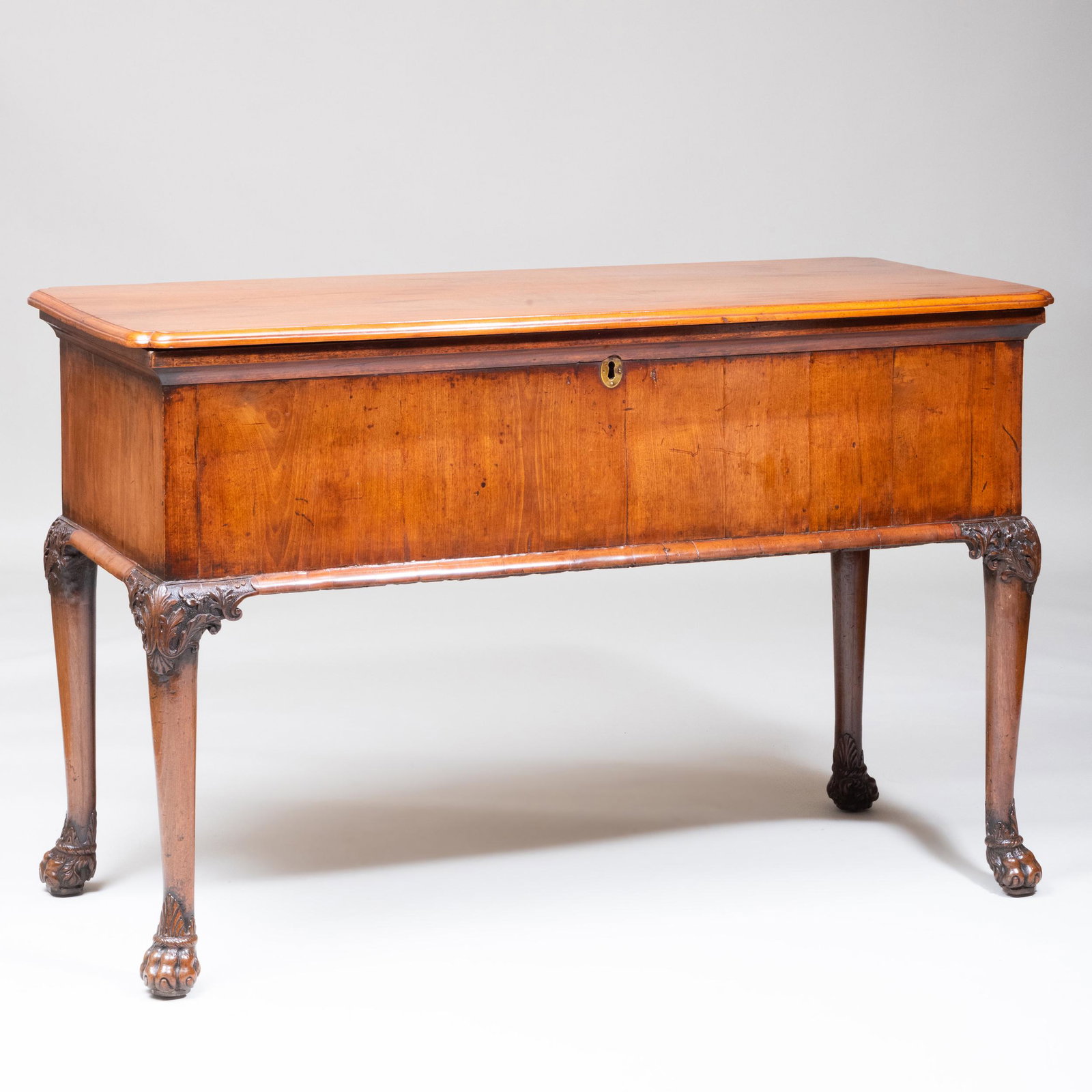 Rare Irish/George II Carved Mahogany Coffer on Stand: Rare Irish/George II Carved Mahogany Coffer on Stand The hinged top opening to a welled interior, raised on cabriole legs carved at the top with acanthus leaves and ending on hairy paw feet. 33 2/4 x 