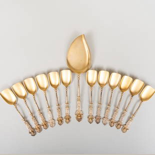 German R. Menart Silver Gilt Dessert Service: German R. Menart Silver Gilt Dessert ServiceMarked '.800'.Comprising:A serving sliceTwelve sorbet spoonsThe slice 9 in., 10.2 oz. approx. weight.