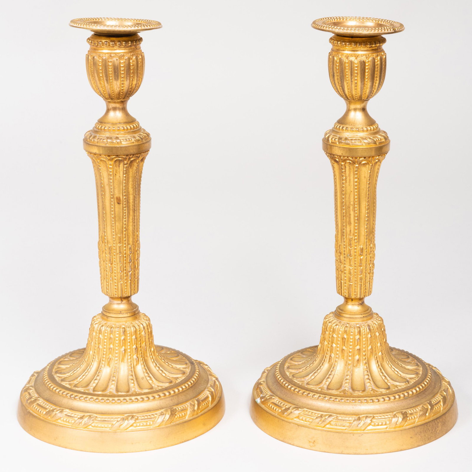 Pair of Louis XVI Style Ormolu Candlesticks: Pair of Louis XVI Style Ormolu Candlesticks 11 x 5 3/4 in. diam.