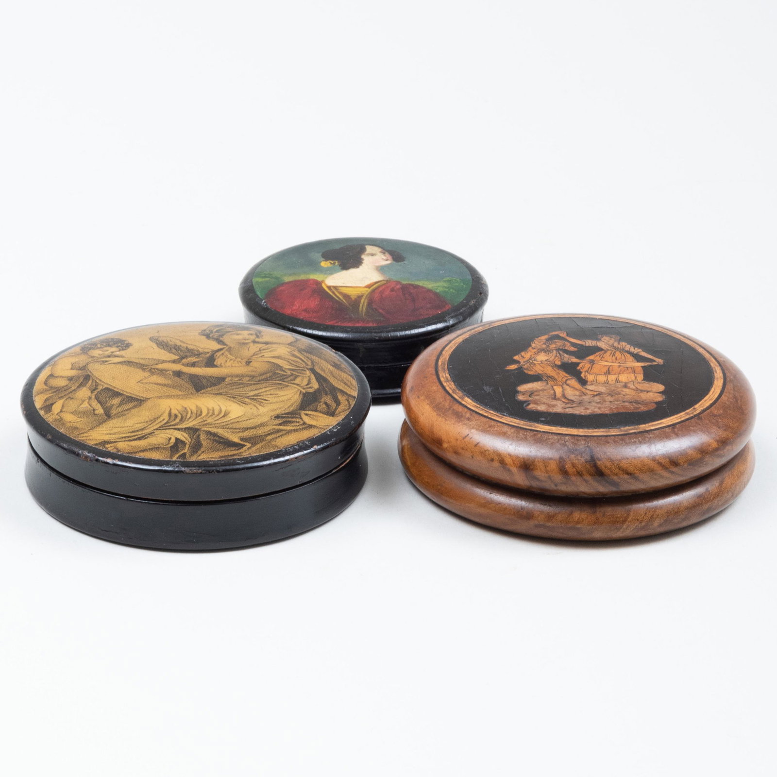 Three Circular Snuff Boxes: Three Circular Snuff Boxes Comprising: A circular lacquer box with the cover with an allegory of painting and phrenology scenes to the box base, print signed 'Gall for Franz Joseph Gall, Vienna (1758-