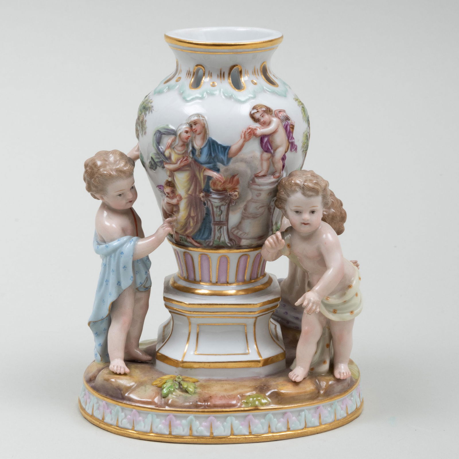 Meissen Porcelain Figure Group of Putti and a Classical: Meissen Porcelain Figure Group of Putti and a Classical Vase Blue crossed sword and incised number mark. 6 x 4 1/2 x 3 3/4 in.