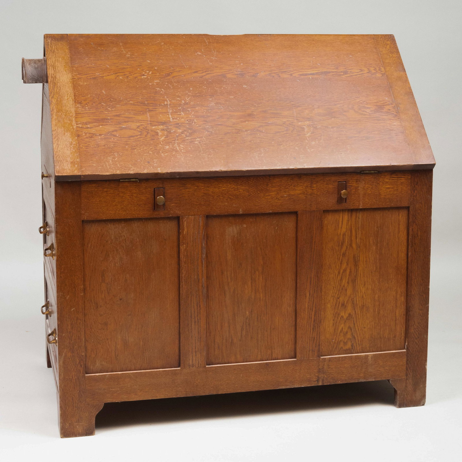 American Oak Partner's Desk: American Oak Partner's Desk With hinged drop surfaces, each side with a slide with compartments, bridle hook to one side over two drawers, the other with cupboard enclosing shelves. 46 x 48 x 31 in. (