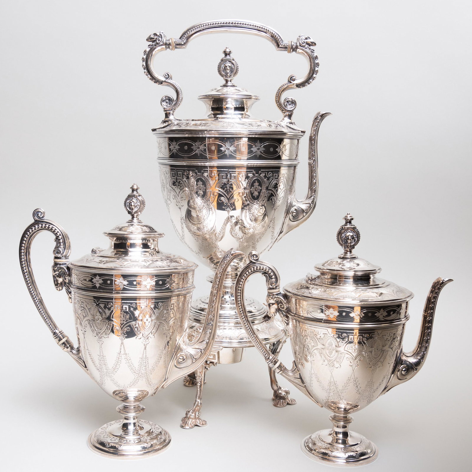 American Three Piece Silver Plate Coffee Service: American Three Piece Silver Plate Coffee Service With bone insulators. Comprising: A hot water kettle on stand A coffee pot A smaller coffee pot The largest 20 in. high.
