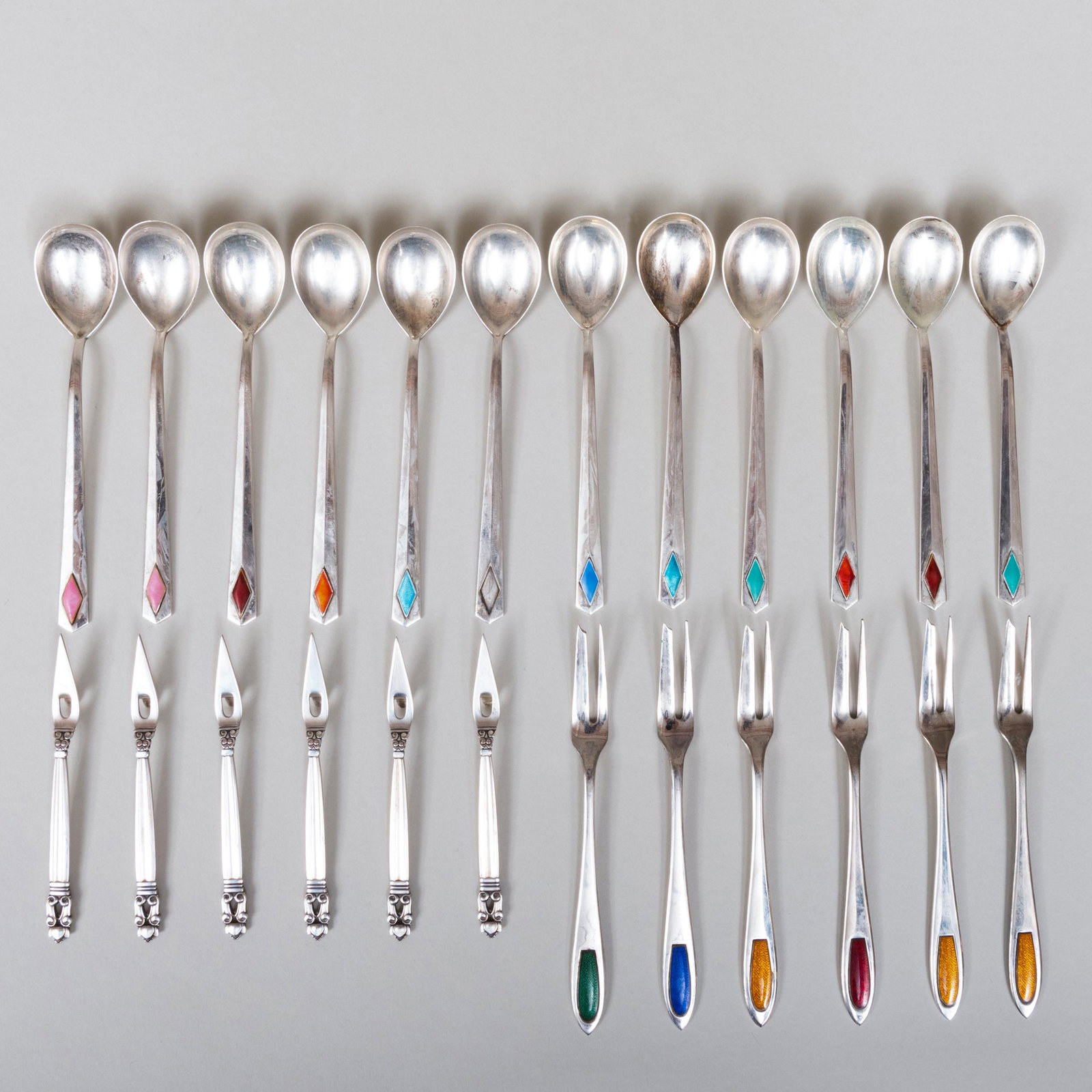 Set of Six Georg Jensen Nut Picks and a Set of: Set of Six Georg Jensen Nut Picks and a Set of Modernist Silver and Enamel Flatware The Jensen marked 'Sterling'. The modernist flatware comprising: Twelve teaspoons Six escargot forks The spoons 4 3/