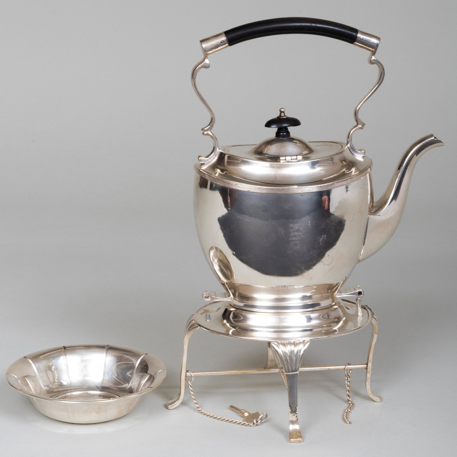 American Silver Plate Hot Water Kettle on Stand and a: American Silver Plate Hot Water Kettle on Stand and a Silver Bowl The bowl marked 'Sterling'. The kettle on stand 13 1/2 in. high, the bowl 5 3/8 in. diam., 1.9 oz. approx. weighable. Property of a La