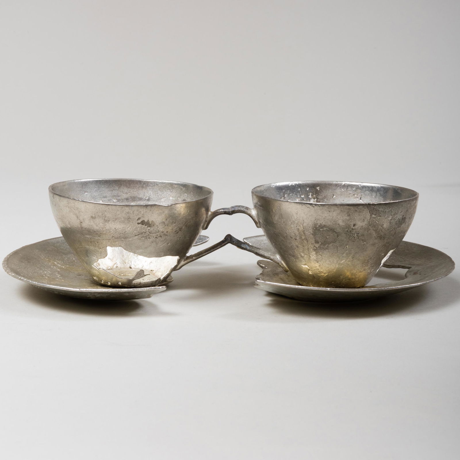 David Clarke (b. 1967): Double Teacup from What is Not: David Clarke (b. 1967): Double Teacup from What is Not Collection Cast pewter, unisgned. 2 1/2 x 10 1/2 x 6 in. Galerie Rosemarie Jager, Hochheim, Gernany, 2015.