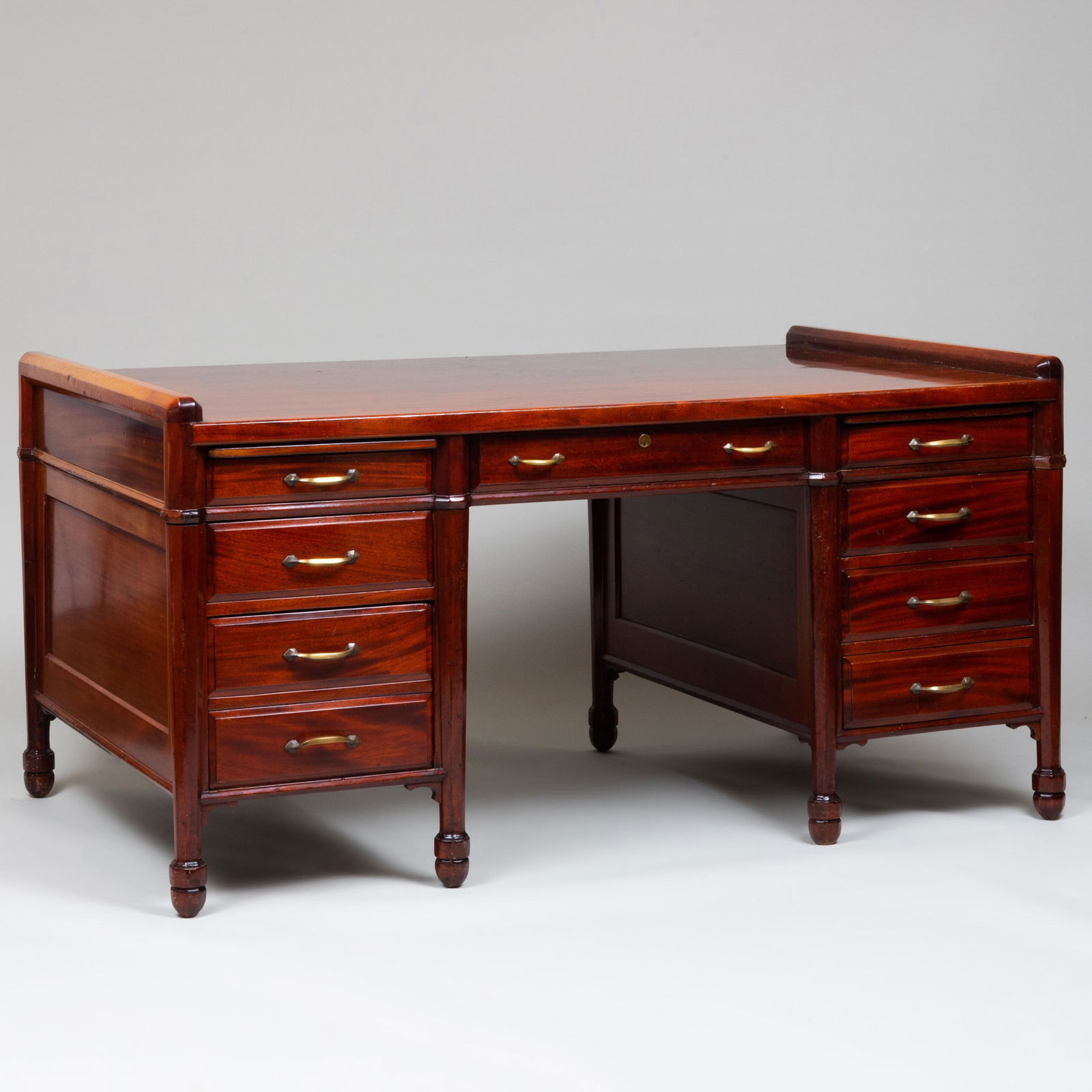 Doten-Dunten Desk Co. Mahogany Executive Desk,: Doten-Dunten Desk Co. Mahogany Executive Desk, Cambridge Massachusetts Stamped, fitted with a central drawer over two pedestals with four drawers. 32 1/2 in. x 5 ft. 4 in. x 38 1/2 in.Les 2 Iles, New