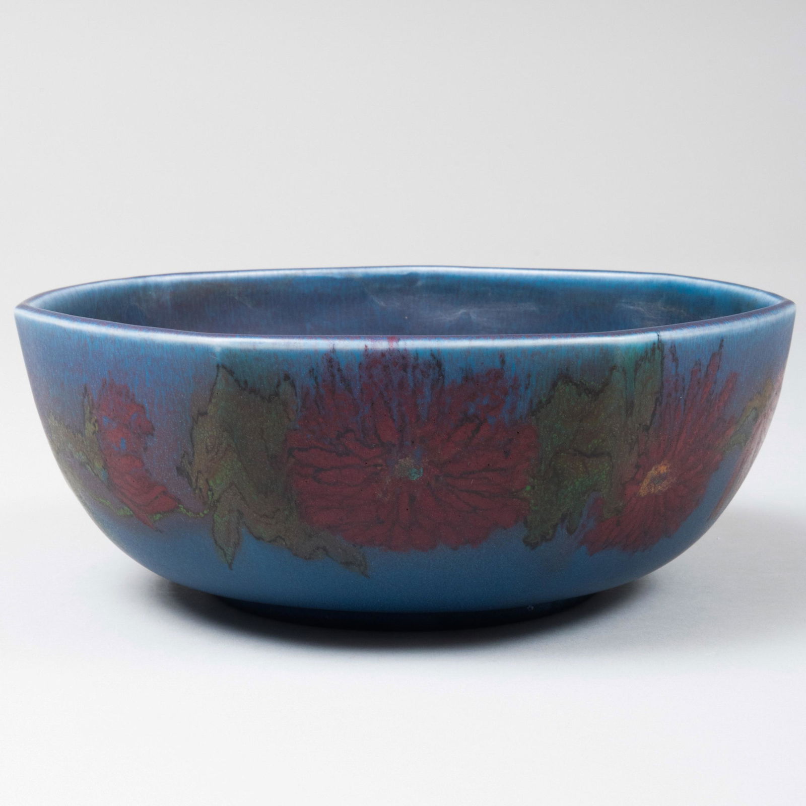Small Rookwood Pottery Blue Glazed Bowl Decorated with: Small Rookwood Pottery Blue Glazed Bowl Decorated with Stylized Flowers Impressed mark. 3 x 7 1/2 in. diam.