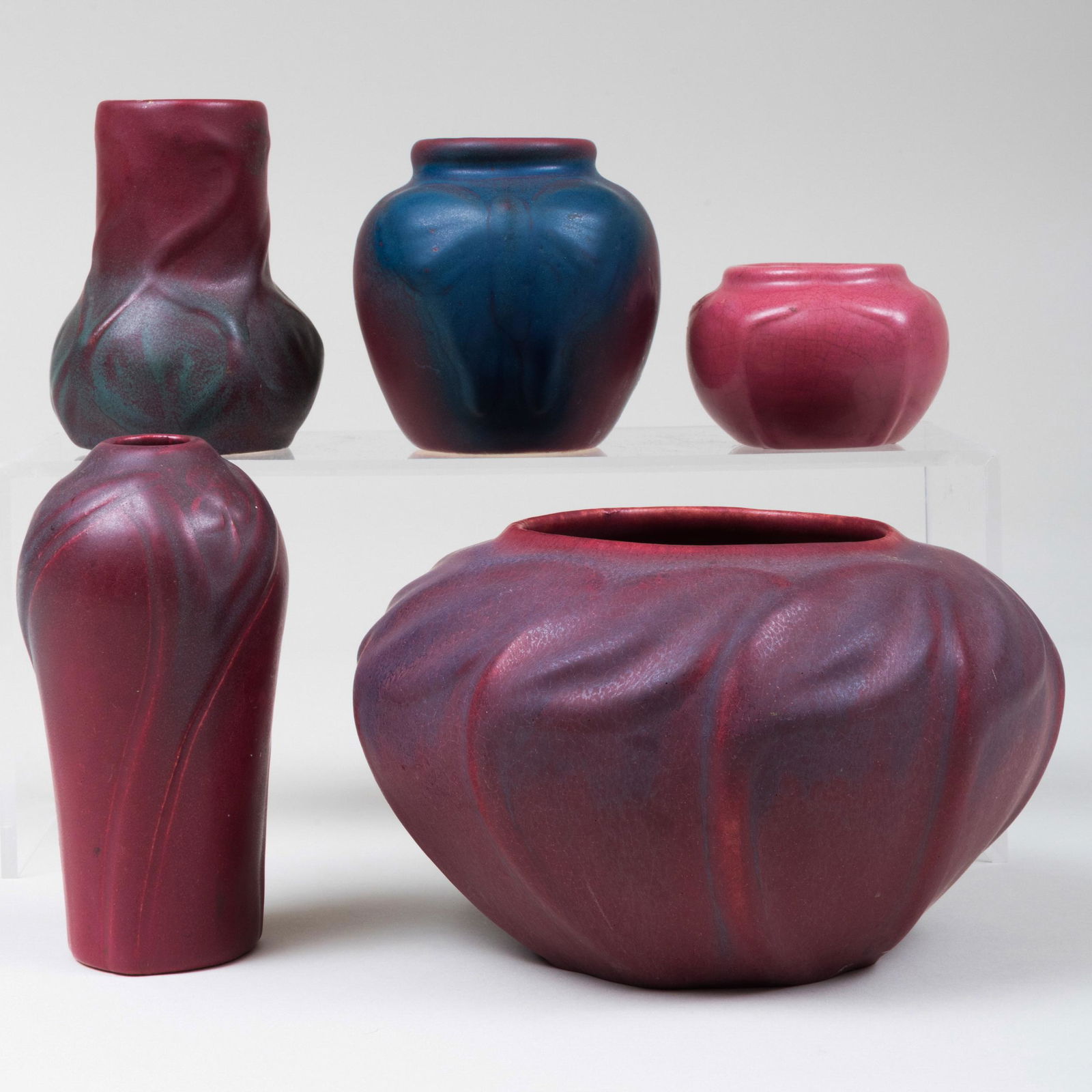 Group of Five Small Van Briggle Pottery Persian Rose: Group of Five Small Van Briggle Pottery Persian Rose Glazed Vases Incised marks. Comprising: An ovoid vase molded with leaves A small high shouldered vase molded with flowers A small bottle vase molde