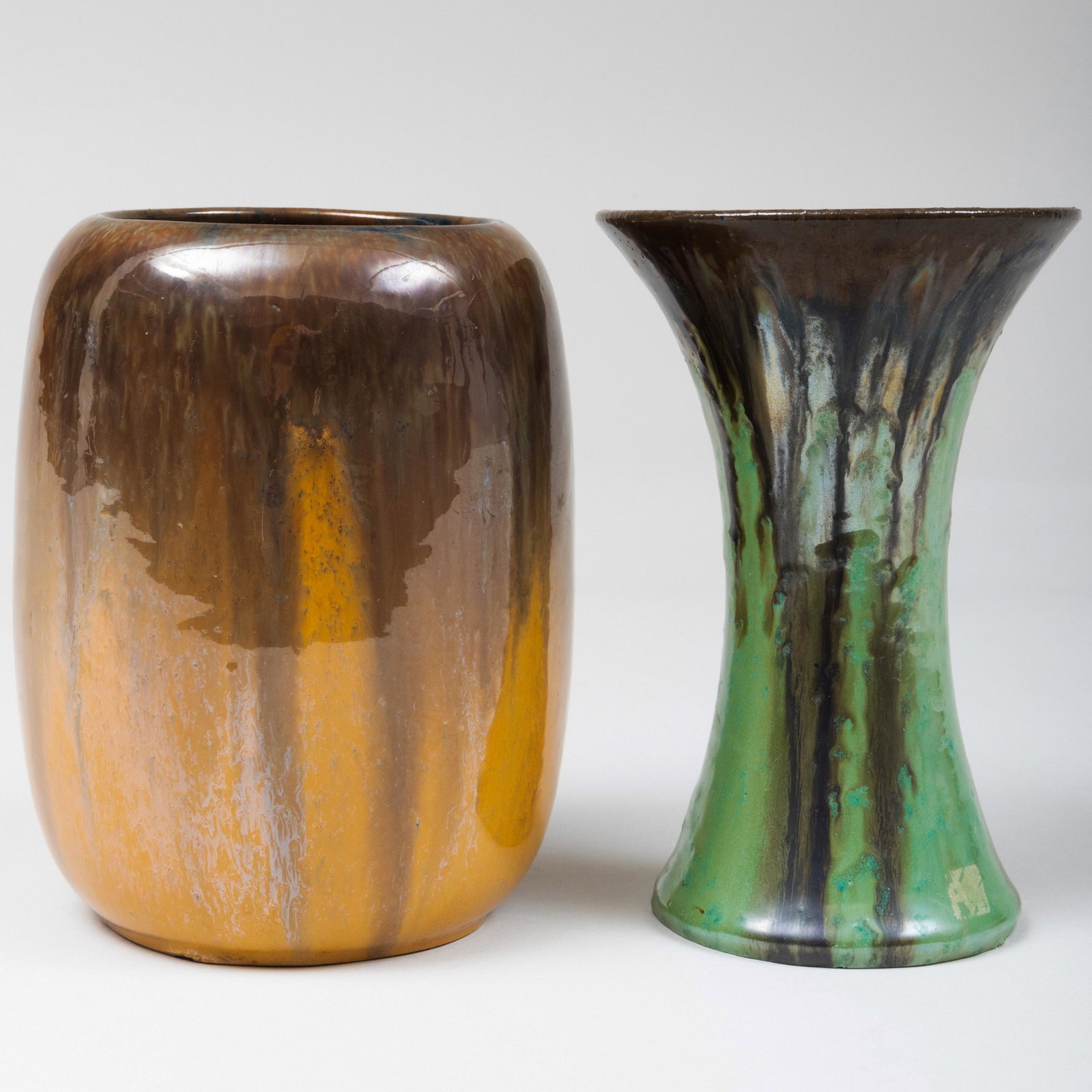 Two Fulper Pottery Iridescent Glazed Vessels: Two Fulper Pottery Iridescent Glazed Vessels Black printed mark. The flared 7 3/8 x 5 in. diam., 7 1/4 x 5 1/2 in. diam.