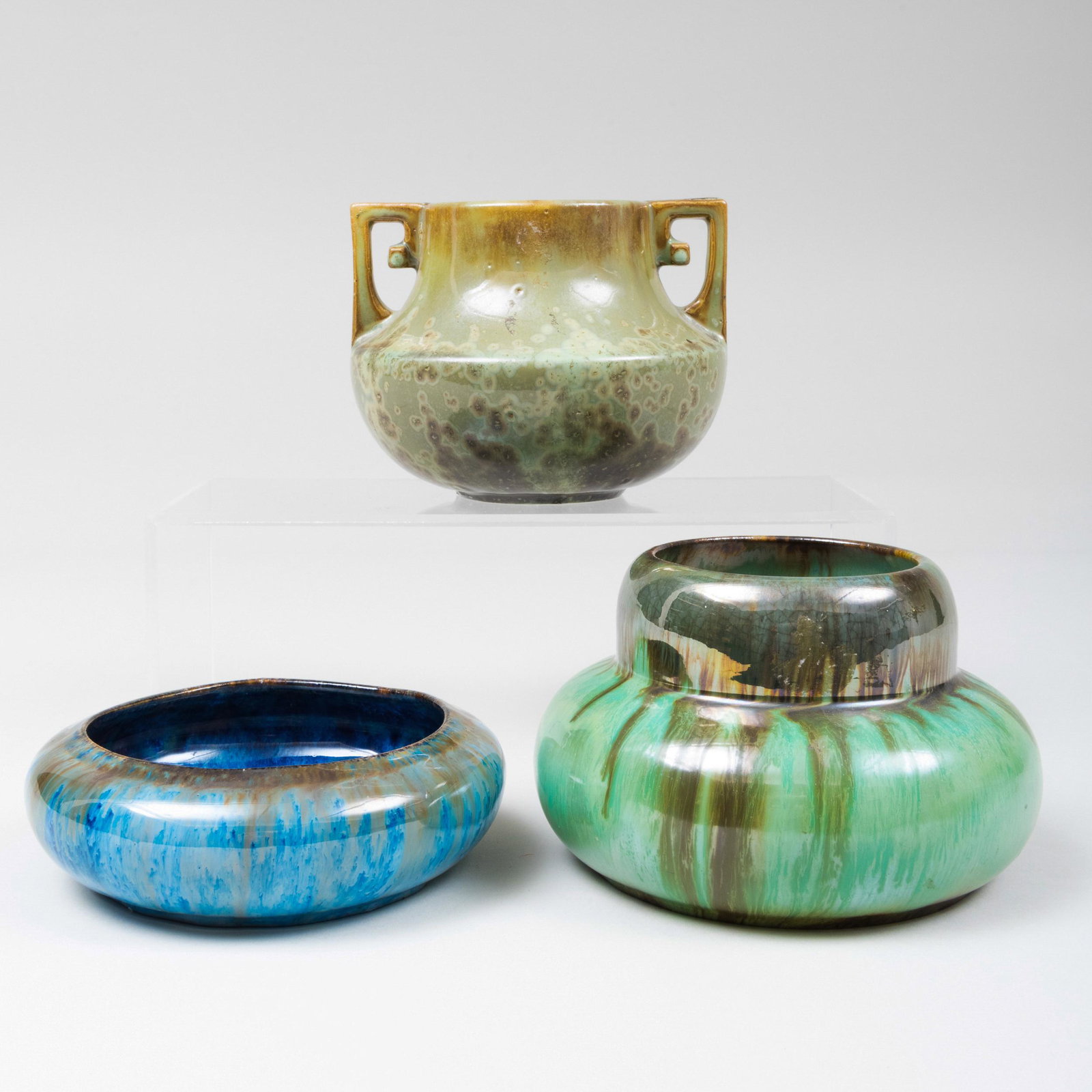 Group of Three Fulper Pottery Crystaline and Iridescent: Group of Three Fulper Pottery Crystaline and Iridescent Glazed Vessels Each with black printed mark. Comprising: A two-handle vase A squat low vase A small low bowl The largest 4 1/2 x 6 x 5 1/2 in.