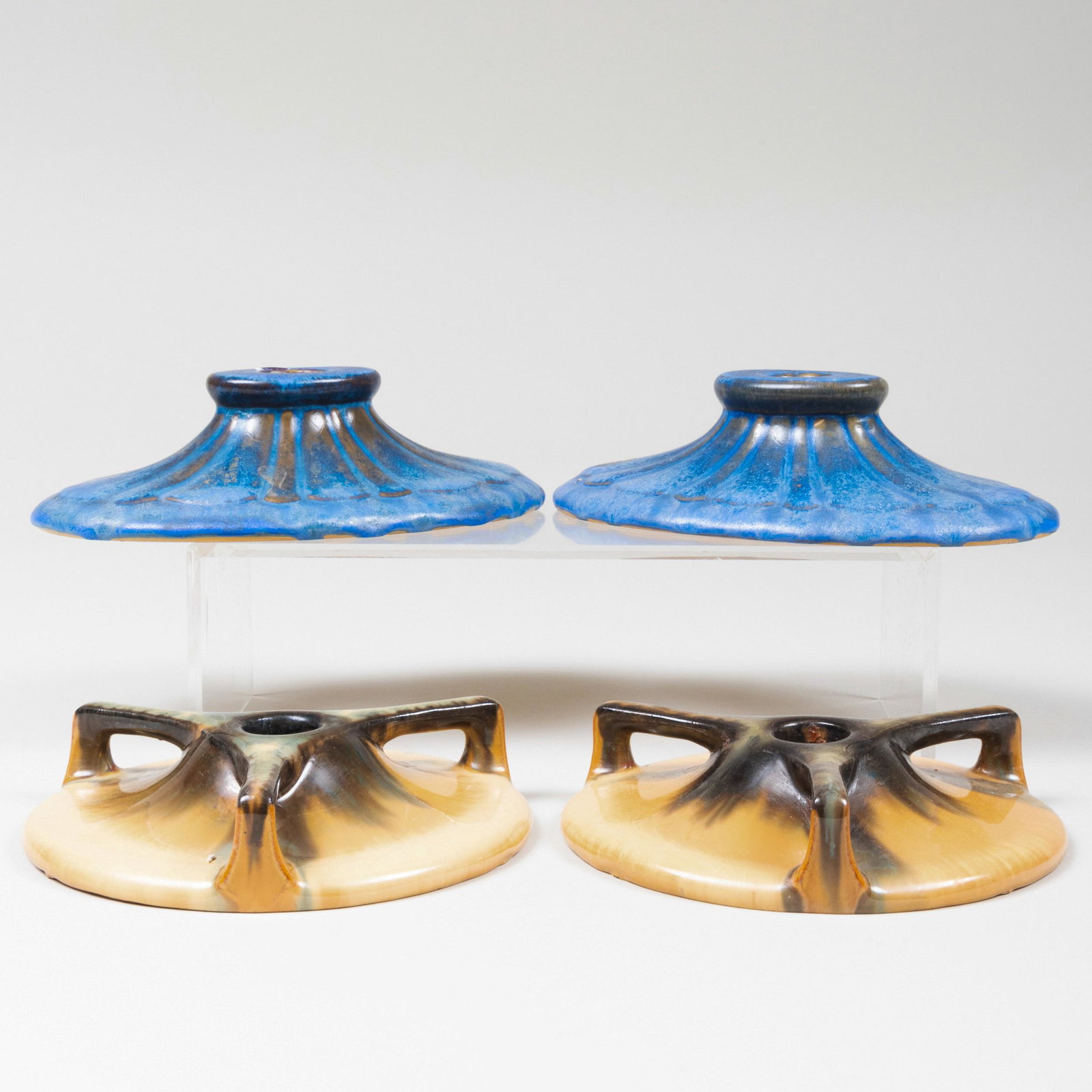 Two Pairs of Fulper Pottery Glazed Candlesticks: Two Pairs of Fulper Pottery Glazed Candlesticks Black printed mark. The blue glazed 2 x 7 1/2 x 5 in., the cat's eye flambé glaze 1 1/4 x 6 in. diam.