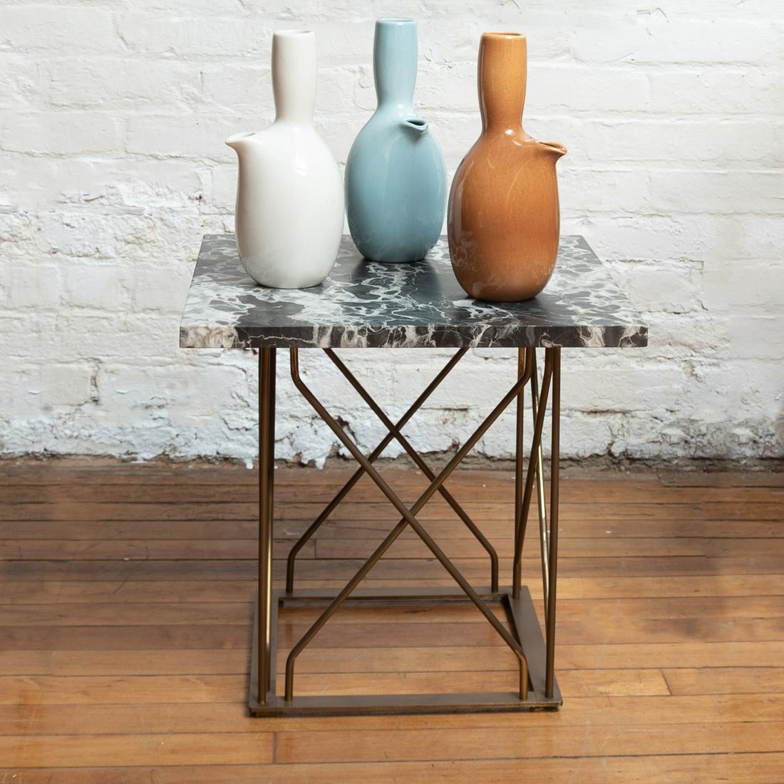 Three Russel Wright Porcelain 'Iriquois' Pitchers: Three Russel Wright Porcelain 'Iriquois' Pitchers Black printed mark. 10 1/4 x 5 x 4 in.