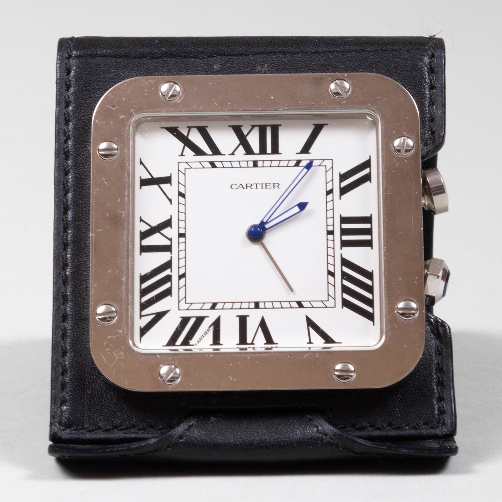Cartier Steel and Leather 'Santos De Cartier' Traveling: Cartier Steel and Leather 'Santos De Cartier' Traveling Clock Dial and reverse signed; fitted red case. 2 1/2 x 2 1/2 x 3 1/2 in. (overall). Cartier, NY.