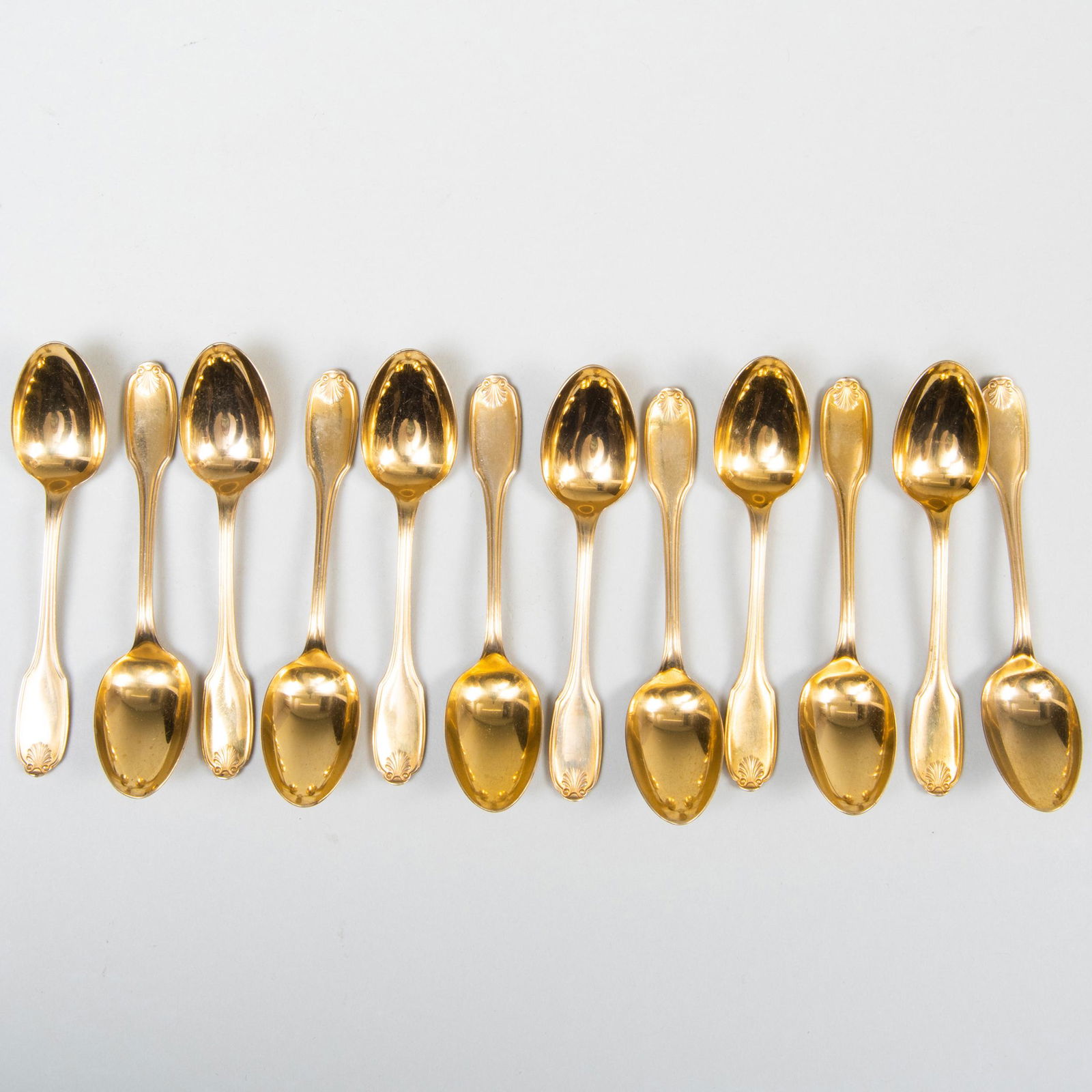 Set of Twelve Christofle Gold Plated Silver Plate: Set of Twelve Christofle Gold Plated Silver Plate Demitasse Spoons 4 in. long.