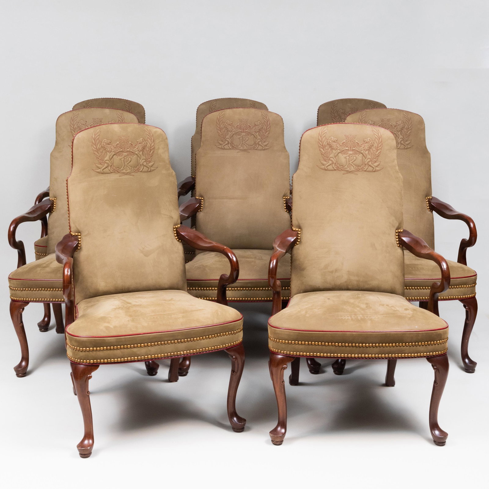 Eight George I Style Mahogany and Suede Armchairs, of: Eight George I Style Mahogany and Suede Armchairs, of Recent Manufacture The suede embroidered with a 'K' flanked by rampant lions. 43 x 26 1/2 x 23 1/2 in.