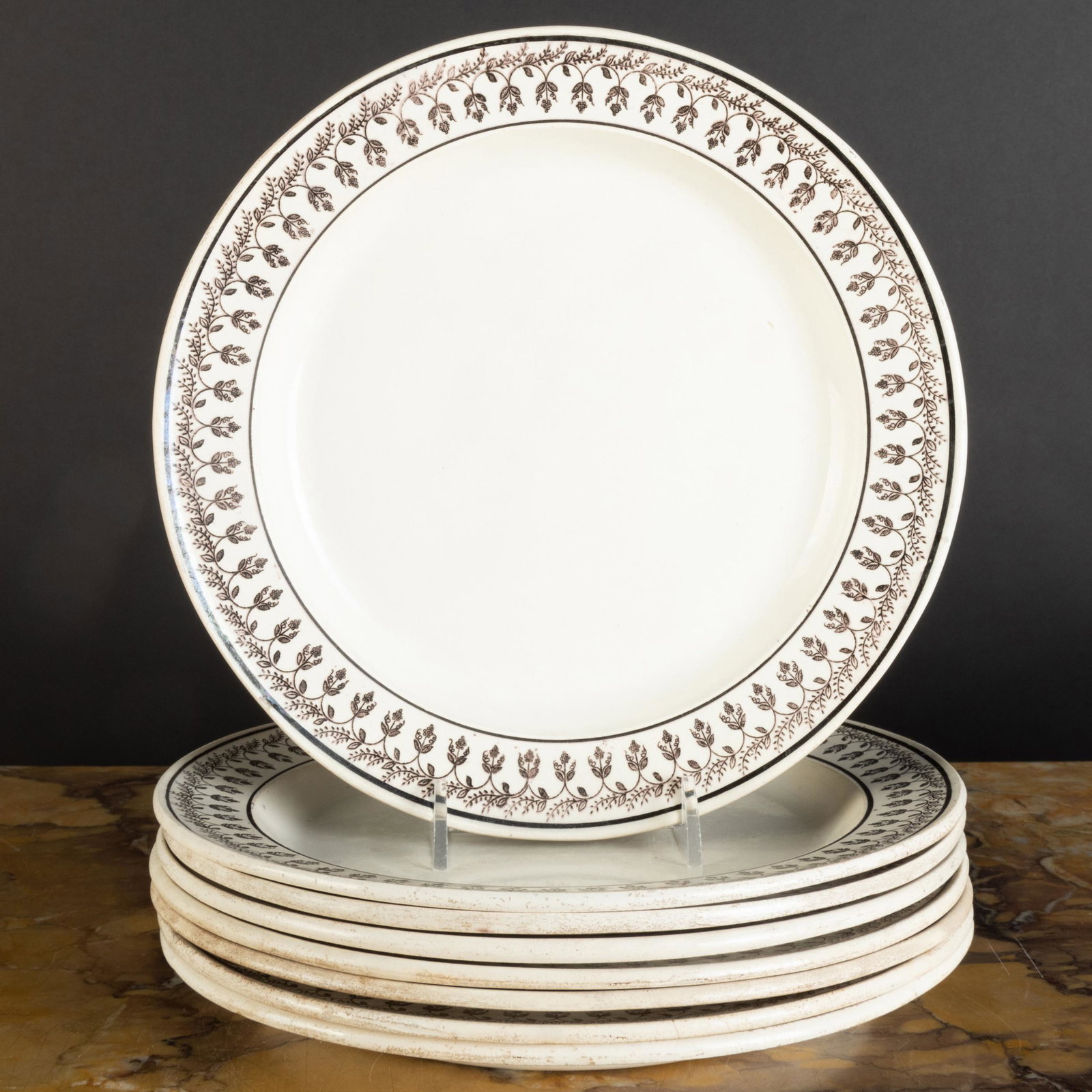 Set of Eight Montereau Transfer Printed Creamware: Set of Eight Montereau Transfer Printed Creamware Plates with Flower Garland Rim Impressed marks. 8 1/2 in. diam. The Neoclassicist: Niall Smith