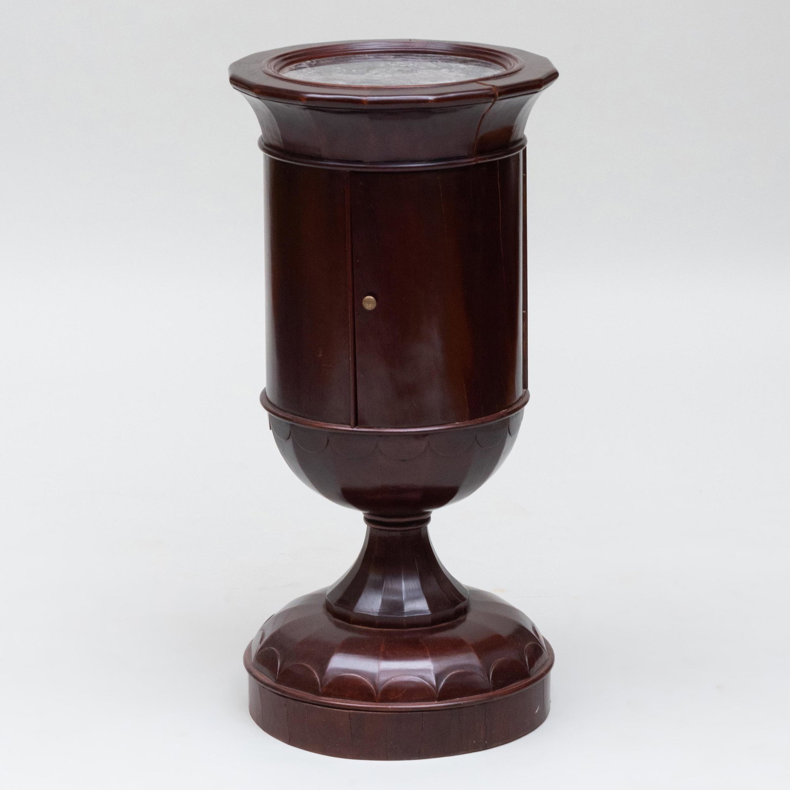 Biedermeier Mahogany and Marble Pedestal Cabinet, in: Biedermeier Mahogany and Marble Pedestal Cabinet, in the Manner of Josef Danhauser Fitted with a cupboard door. 34 x 16 3/4 in. diam. The Neoclassicist: Niall Smith