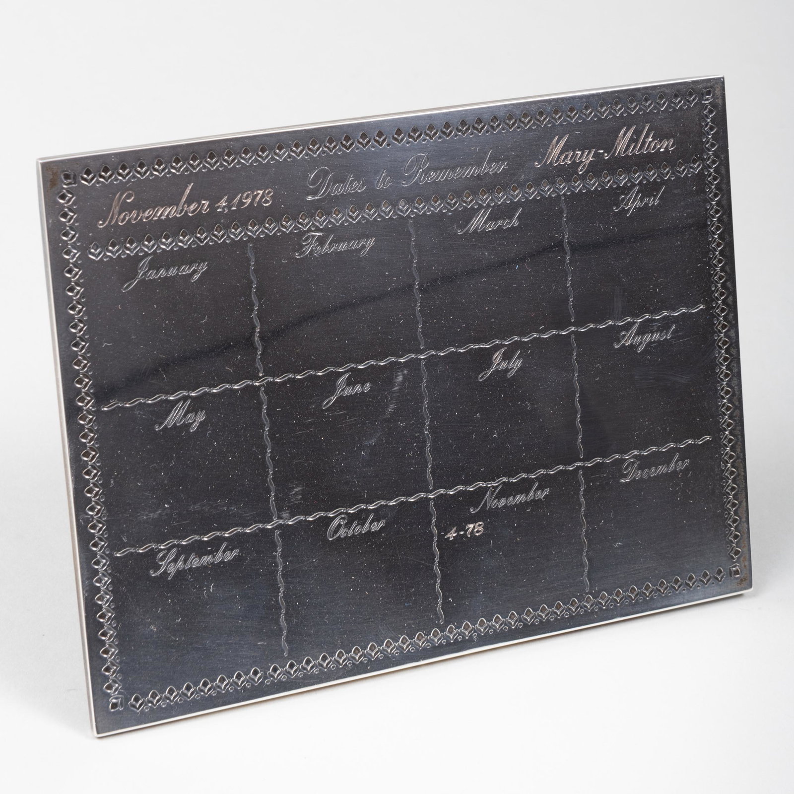 Cartier Silver Wedding Anniversary Desk Calendar: Cartier Silver Wedding Anniversary Desk Calendar Marked 'Sterling'; inscribed 'November 4, 1978, Dates to Remember, Mary - Milton'; with backing. 4 1/4 x 5 1/2 in.; 4.4 oz. approx. gross weight. Prope