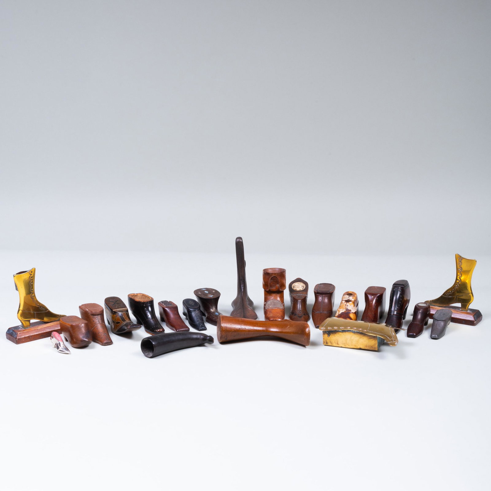 Large Group of Shoe Form Snuff Boxes and Shoe Form: Large Group of Shoe Form Snuff Boxes and Shoe Form Objects Comprising: Two wood boxes Five wood boxes with nail designs A box with bone inlay A black lacquer box with inlay A pewter box A wood box m