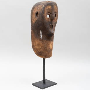 Zaramo Carved and Stain Wood Mask, Tanzania: Zaramo Carved and Stain Wood Mask, Tanzania 28 x 8 x 8 in. overall. Height of mask 18 1/2 in. By repute Galerie, Fred Jahn, Munich, Germany. Property from the Collection of Tom Levine