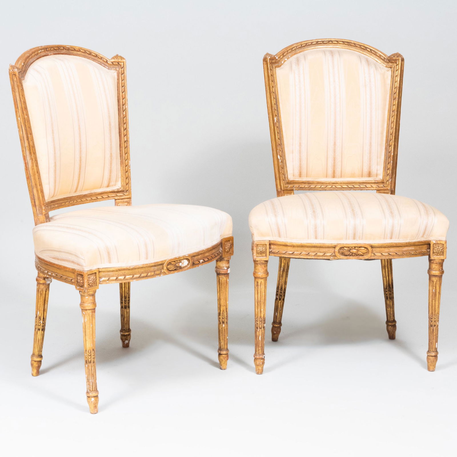 Pair of Louis XVI Giltwood Chaises en Cabriolet: Pair of Louis XVI Giltwood Chaises en Cabriolet 36 x 22 x 15 in.