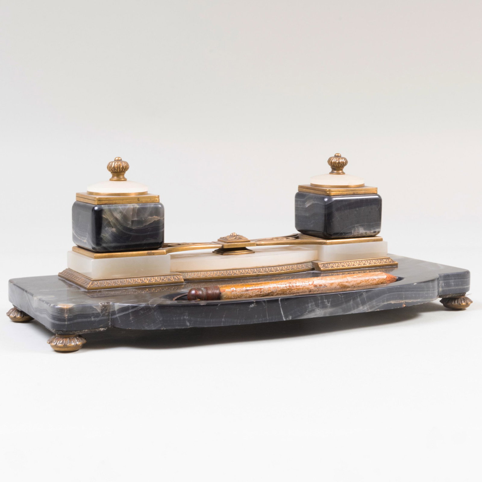 Art Nouveau Brass Mounted Hardstone Inkstand: Art Nouveau Brass Mounted Hardstone Inkstand Together with two porcelain liners and 'The Elephant' pencil. 6 1/4 x 17 3/4 x 8 1/2 in. Property from the Collection of Niall Smith