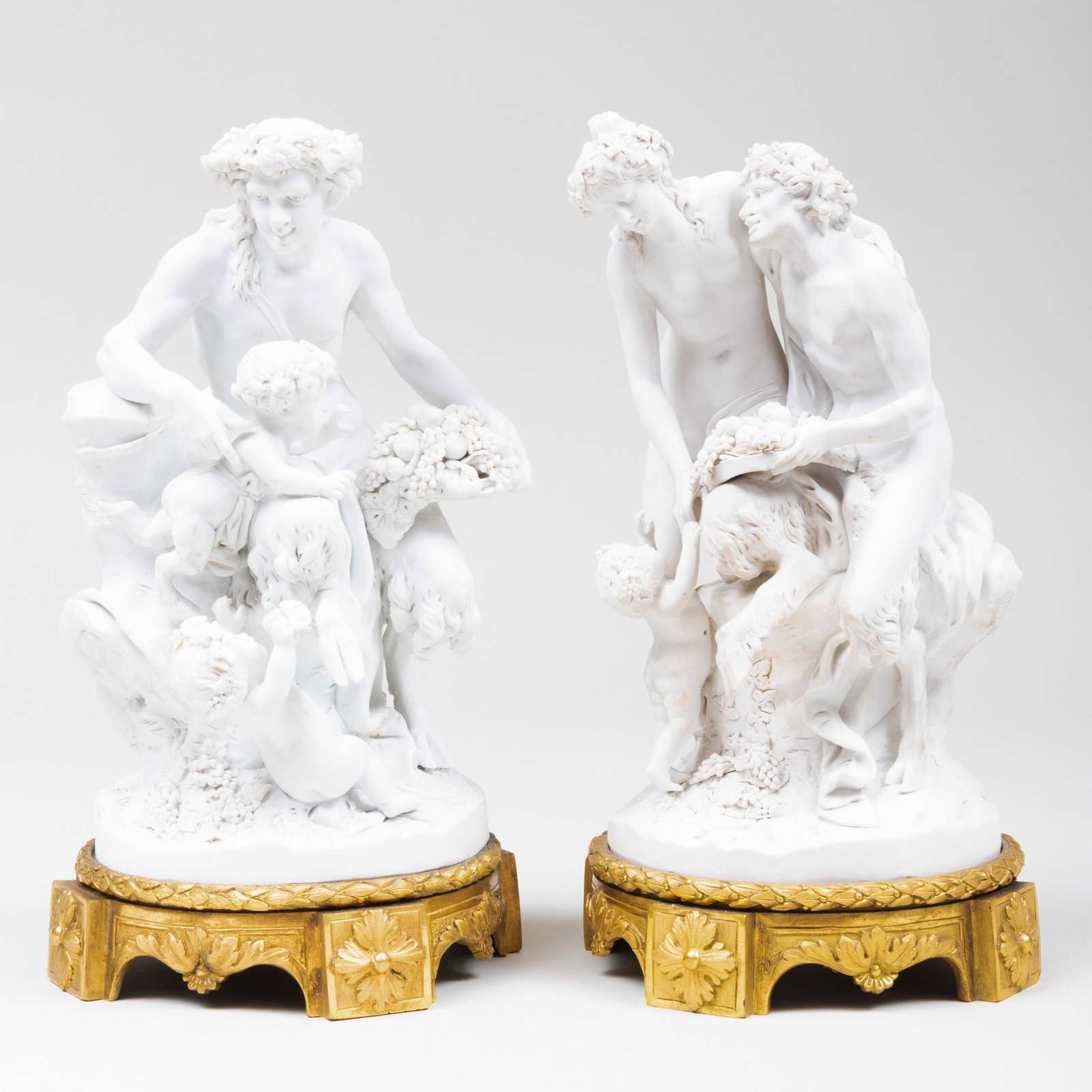 Pair of Continental Biscuit Mythological Figure Groups,: Pair of Continental Biscuit Mythological Figure Groups, After Clodion 12 1/2 x 6 1/2 in. diam. Property from the Estate of Audrey Zauderer
