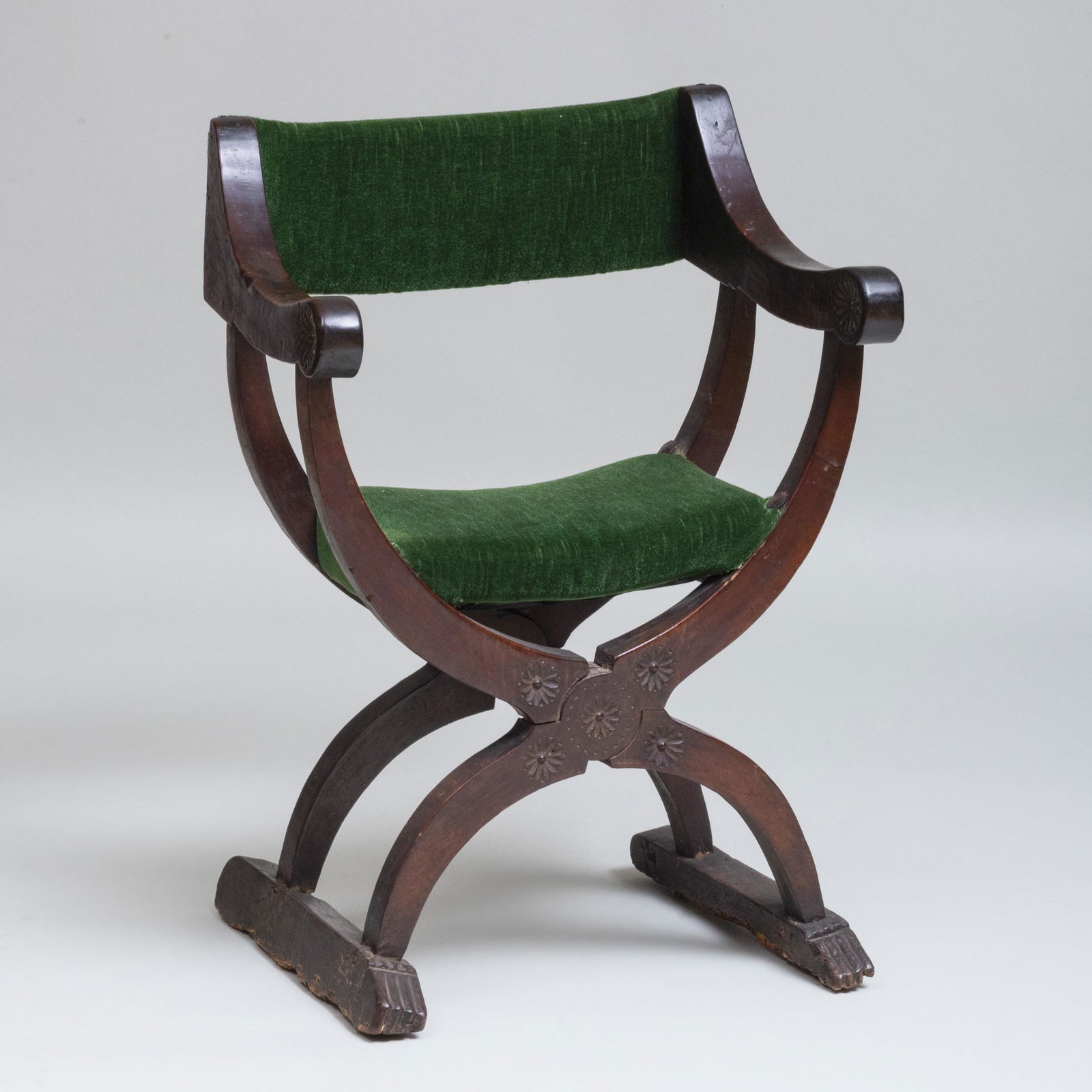 Italian Renaissance Carved Walnut Folding Curule Form: Italian Renaissance Carved Walnut Folding Curule Form 'Dante' Armchair 38 x 26 1/2 x 20 1/2 in., height of seat 20 1/4 in. Note: A related chair from The Collection Of Philip Lehman, Esq, is illustra